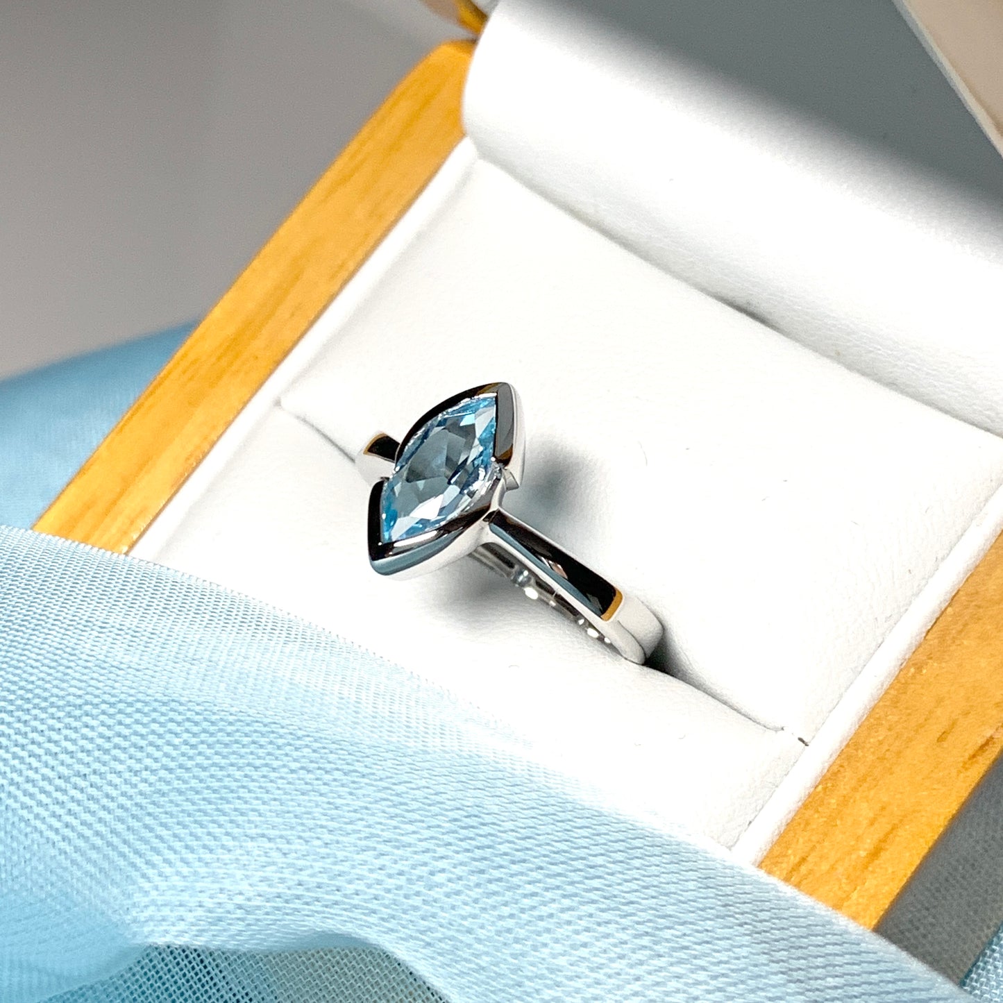 Real blue topaz ladies marquise shaped dress ring