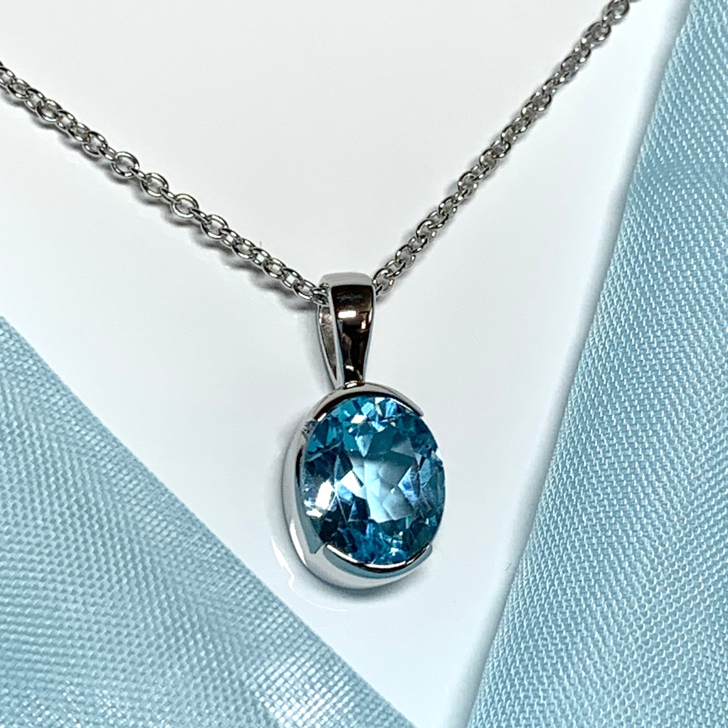 Real blue topaz necklace pendant oval smooth rubbed over setting