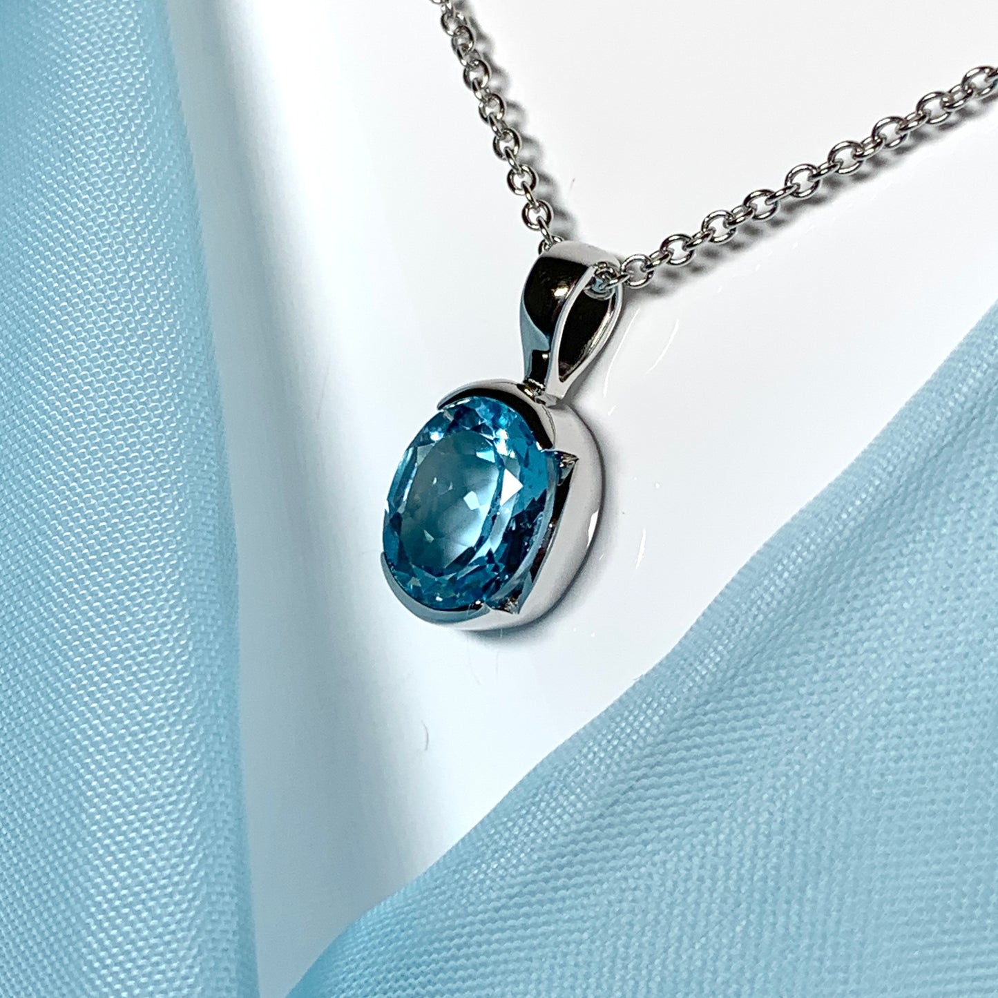 Real blue topaz necklace pendant oval smooth rubbed over setting