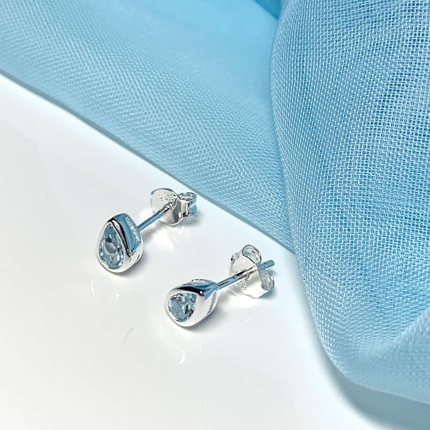 Real blue topaz pear shaped sterling silver stud earrings