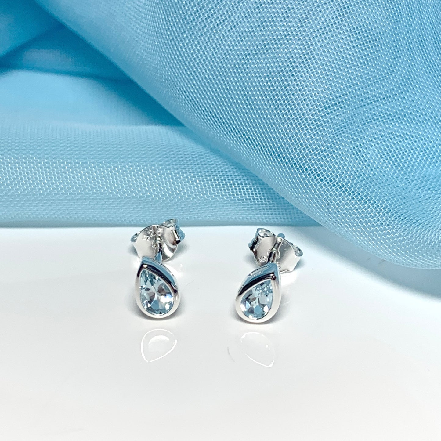 Real blue topaz pear shaped sterling silver stud earrings