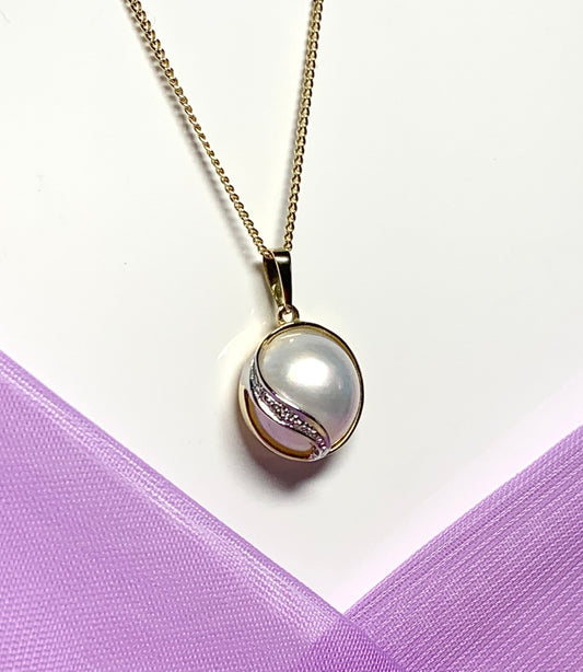Real cultured mabe pearl and diamond pendant yellow gold