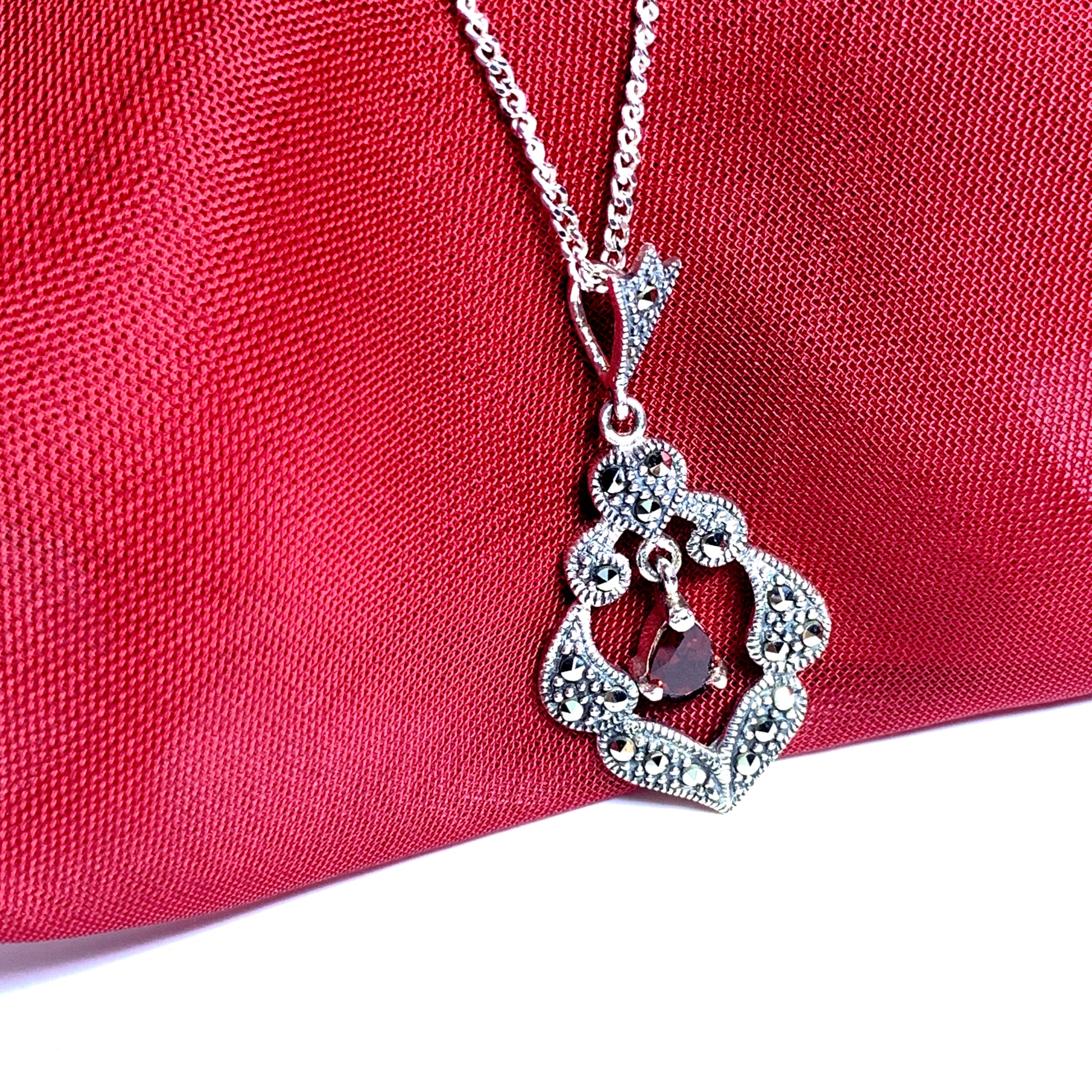 Real garnet and marcasite open pierced silver necklace