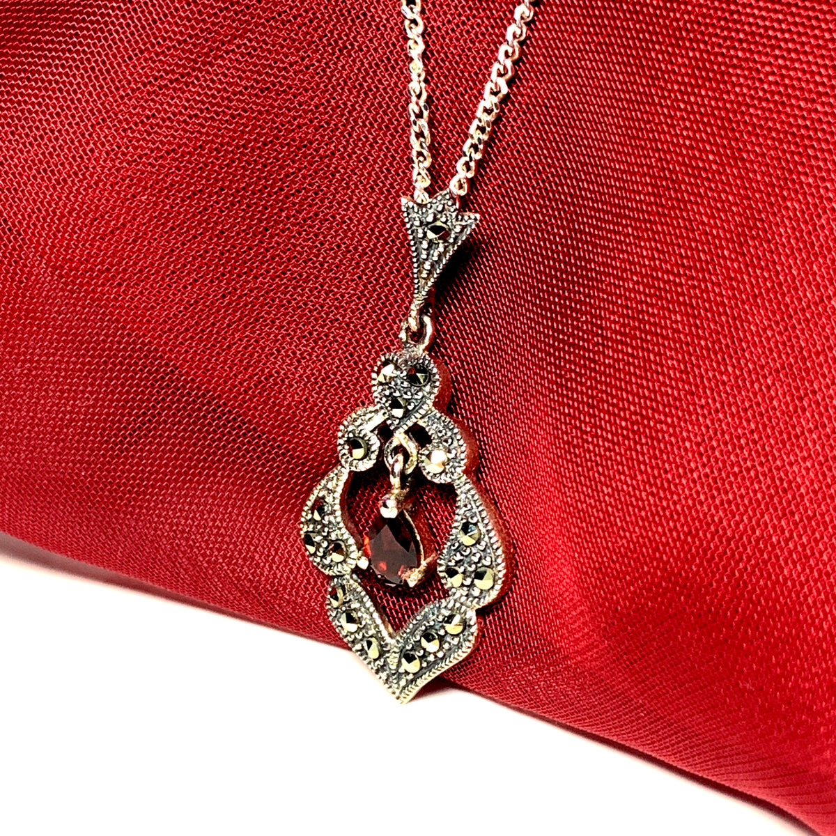 Real garnet and marcasite open pierced silver necklace