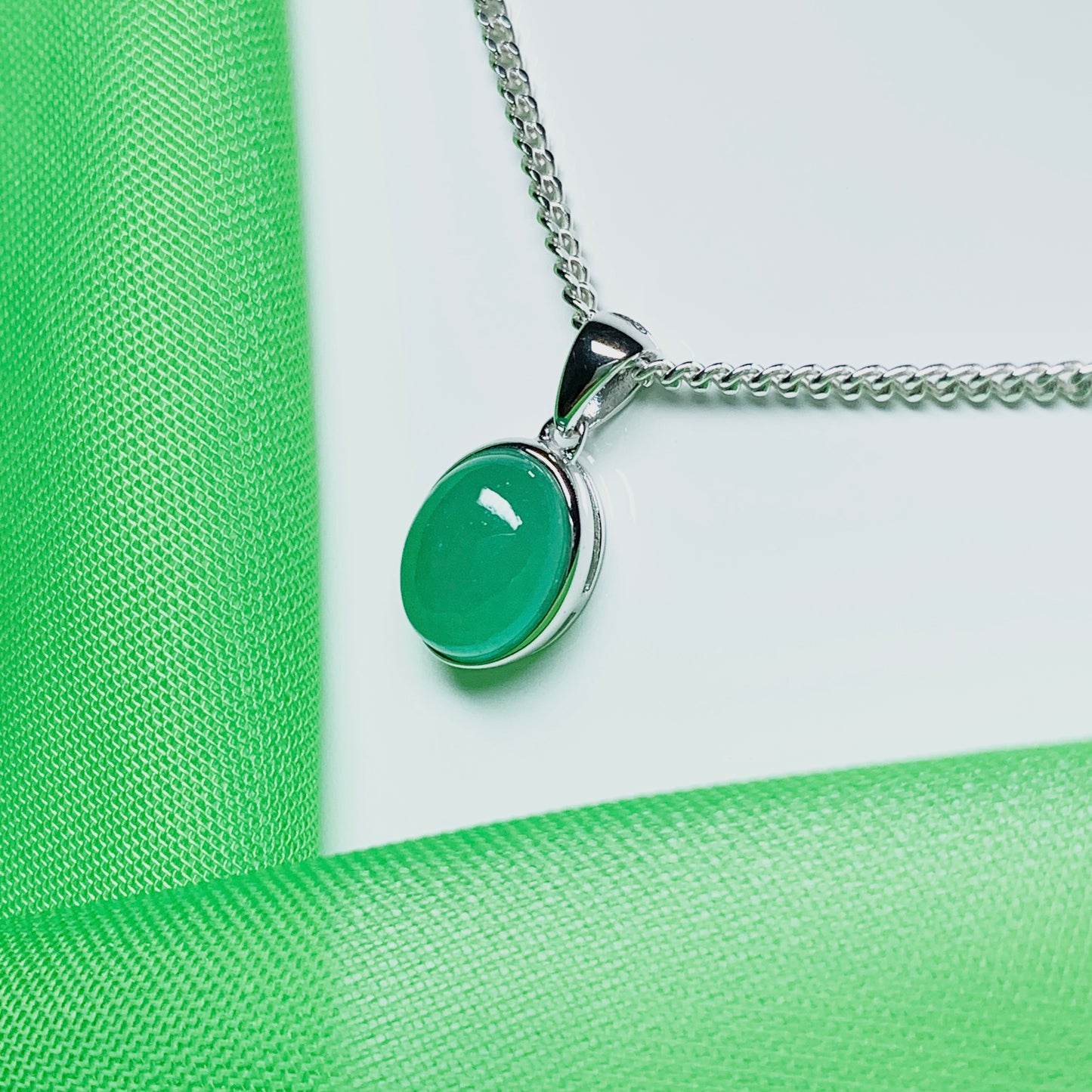 Real green jade necklace white gold oval rubbed over smooth setting