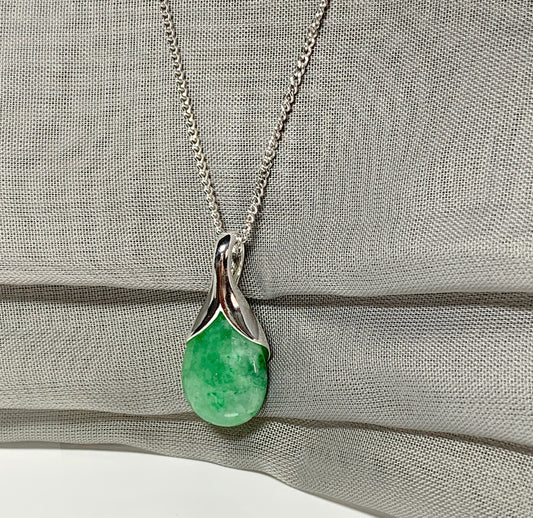 Real green jade pendant necklace in a teardrop shaped or pear shaped