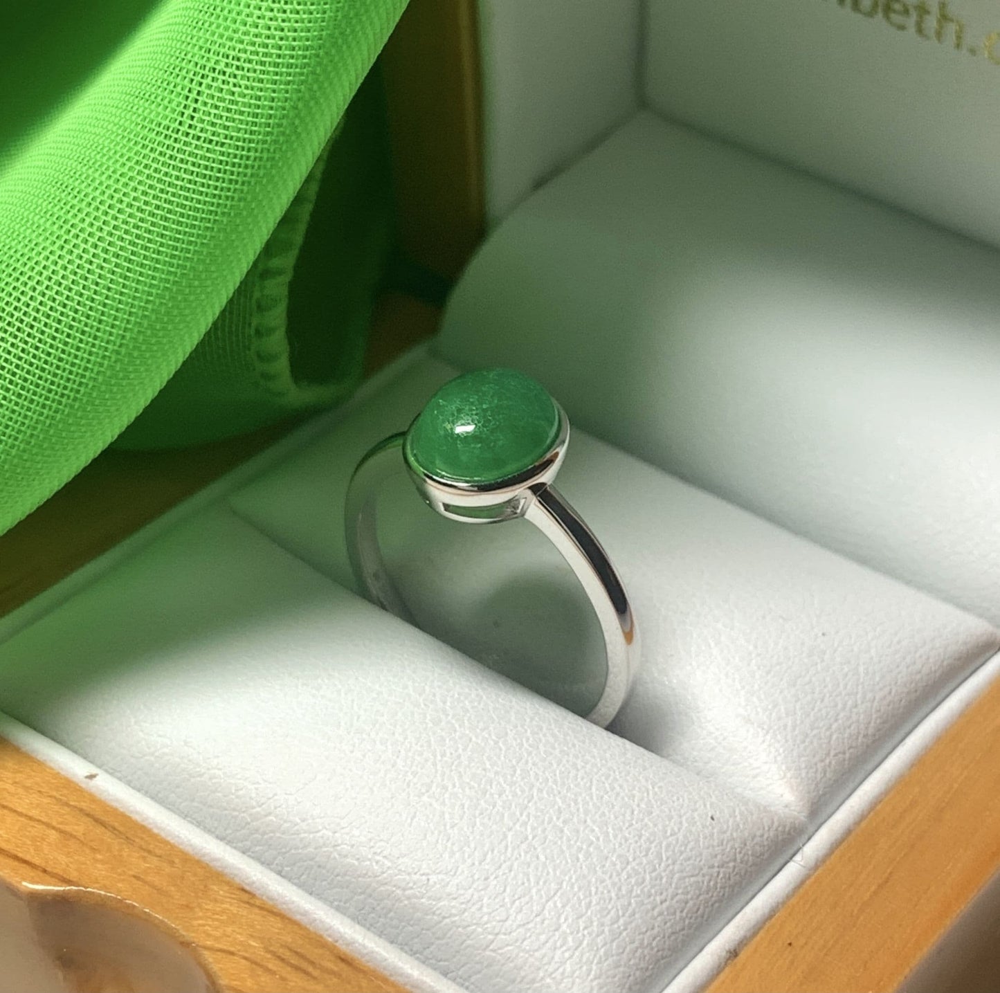 Real jade ring green oval white gold rubbed over smooth setting