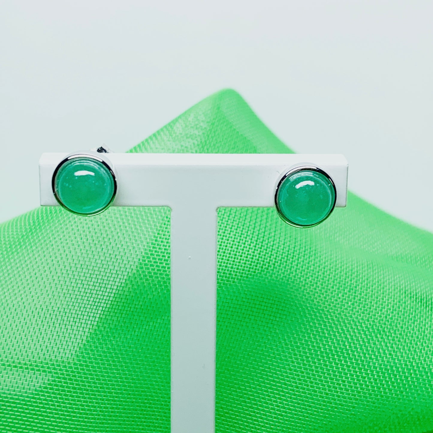 Real jade stud earrings green round rubbed over smooth setting white gold