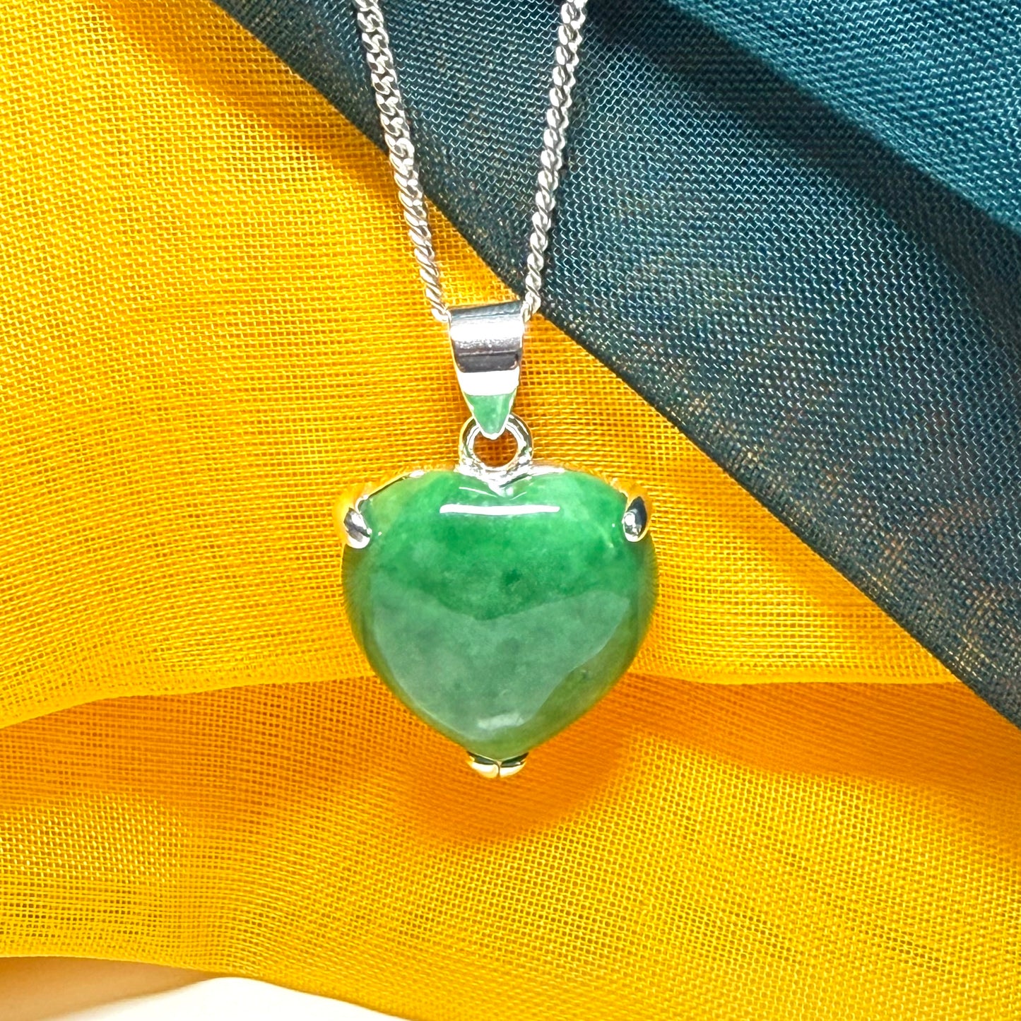 A really stunning real green jade necklace heart shaped sterling silver with a curb chain included as well