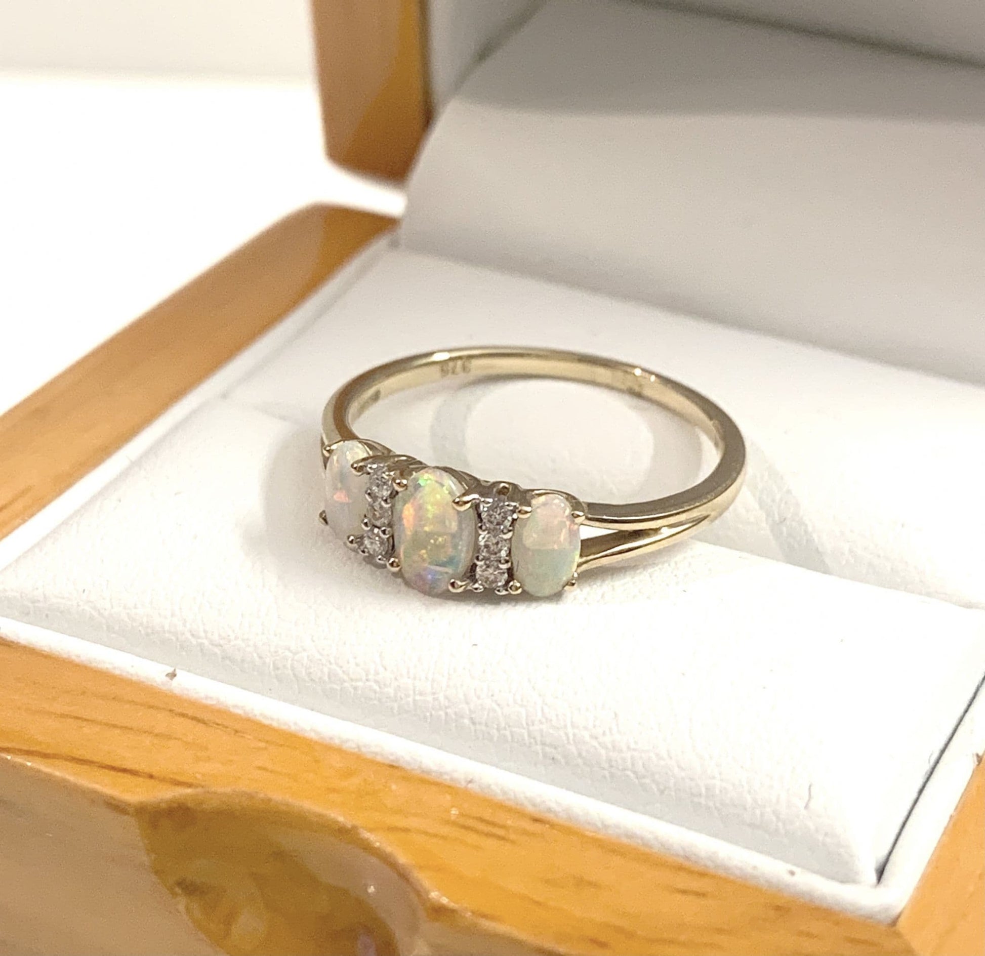 Real opal and diamond trilogy dress ring