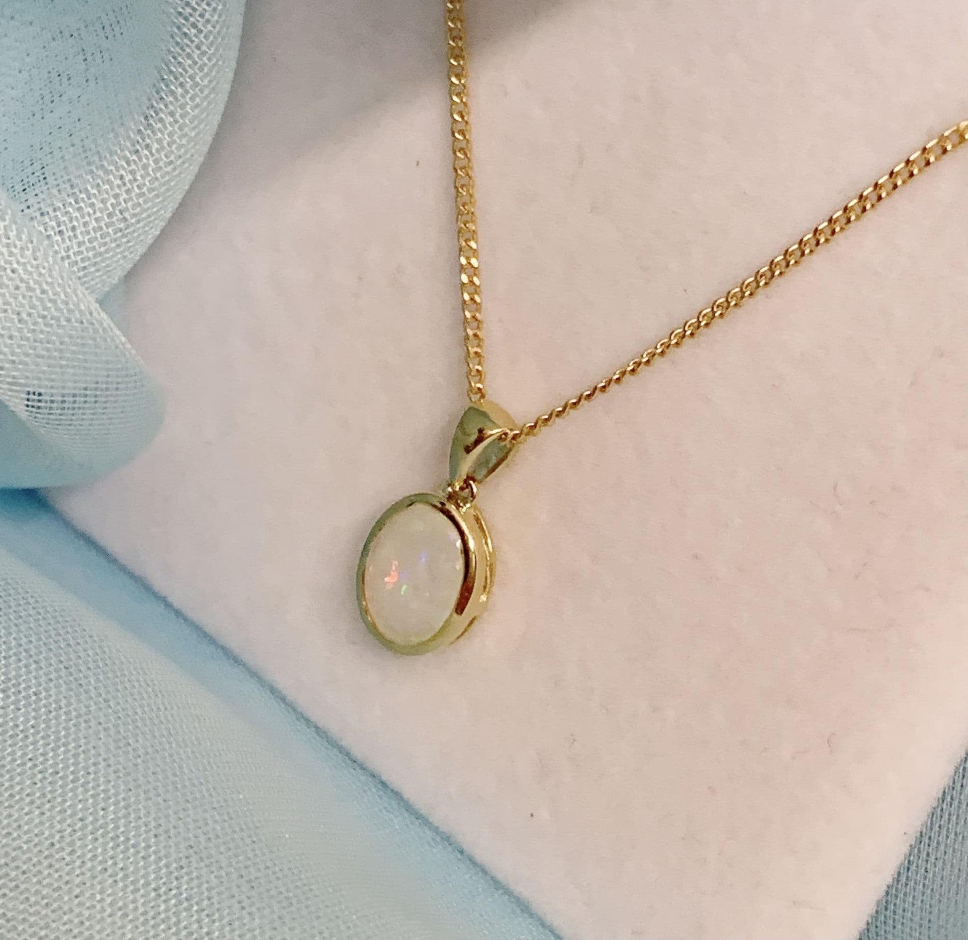 Real opal necklace yellow gold oval pendant smooth rubbed over setting