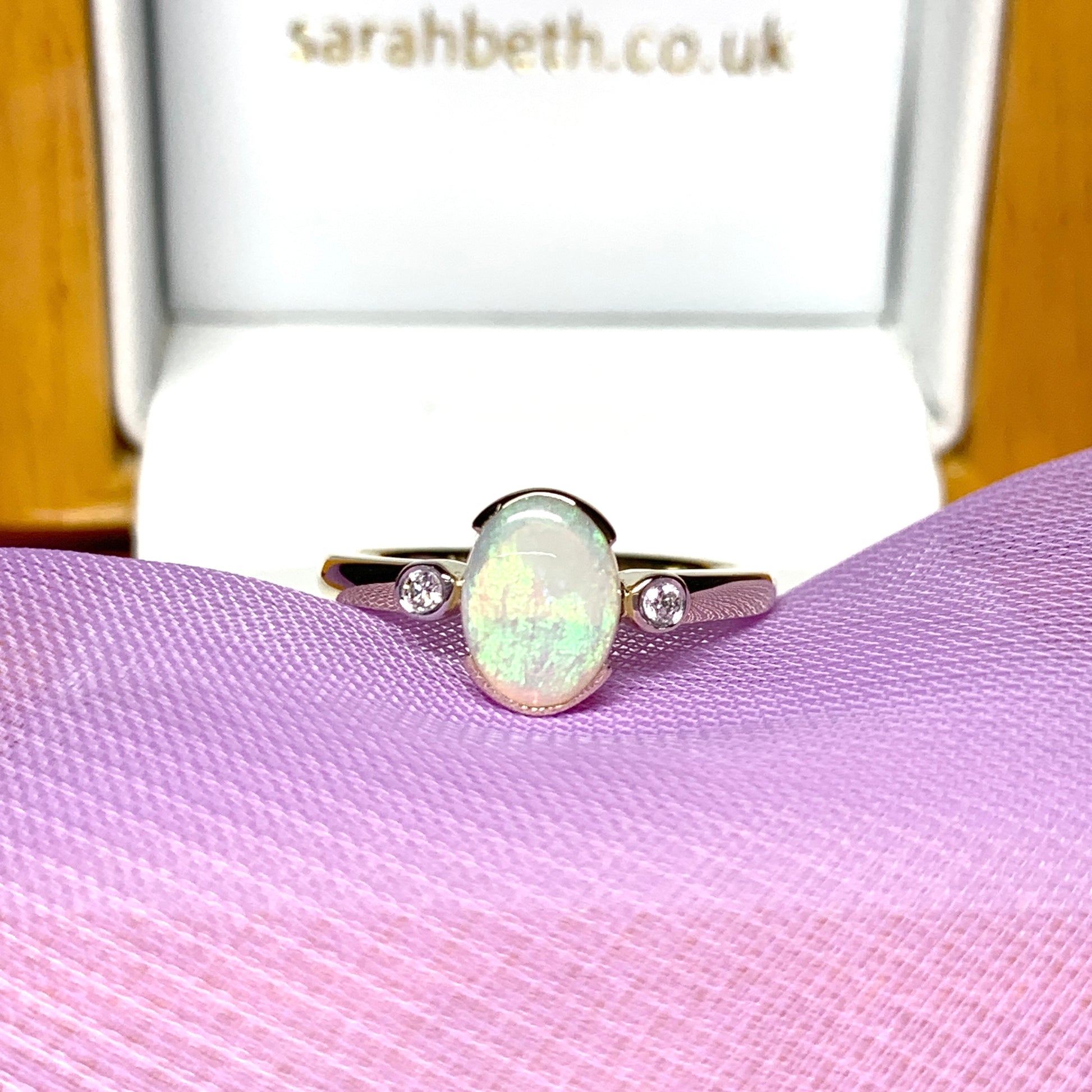 Real opal ring with diamond oval yellow gold