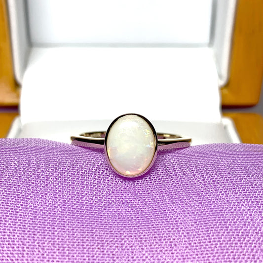 Real opal ring oval yellow gold smooth rubbed over setting