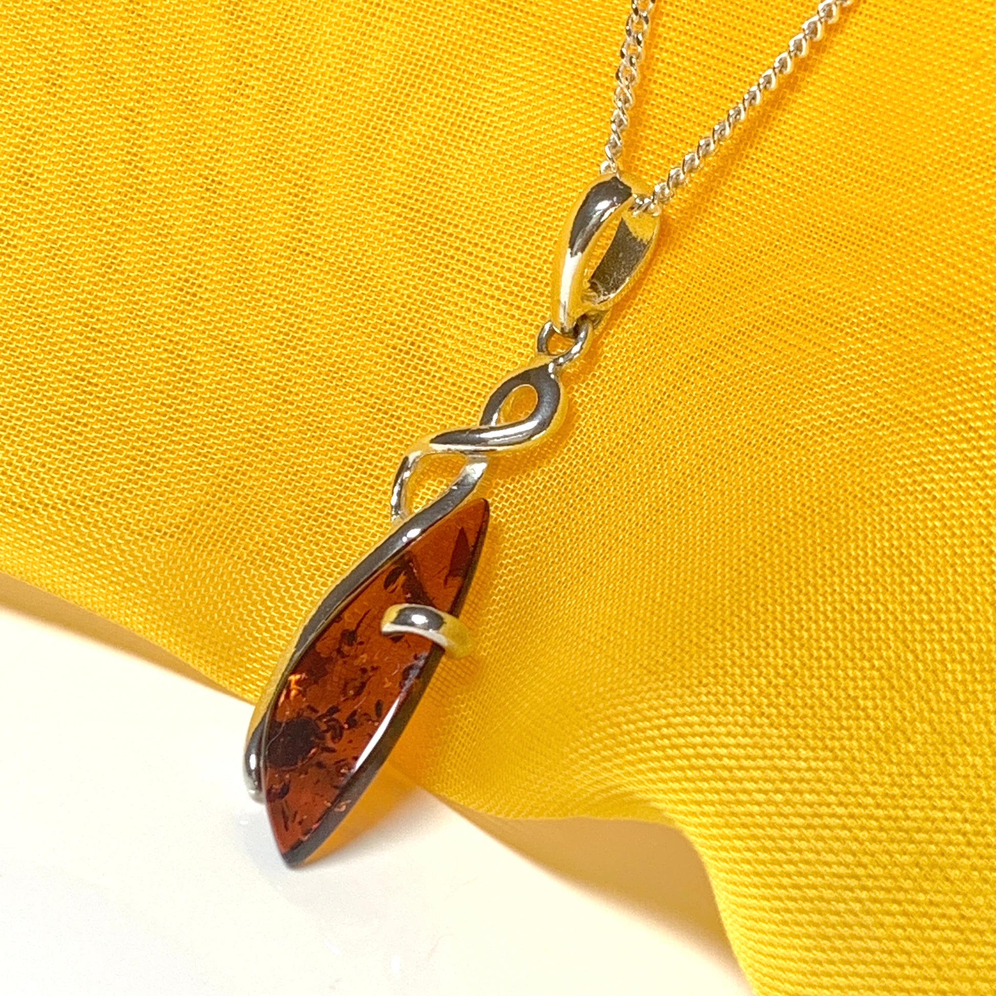 Real amber fancy swirl necklace sterling silver