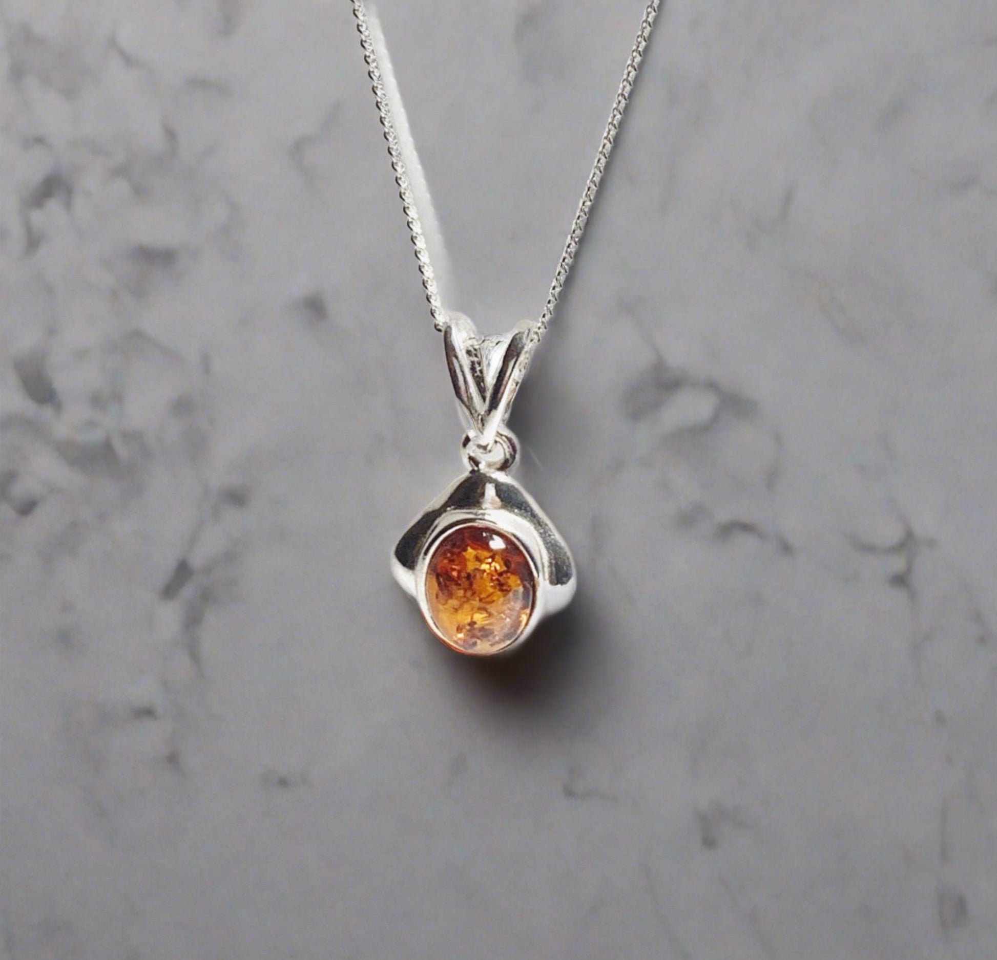 Orange amber oval cushion sterling silver necklace