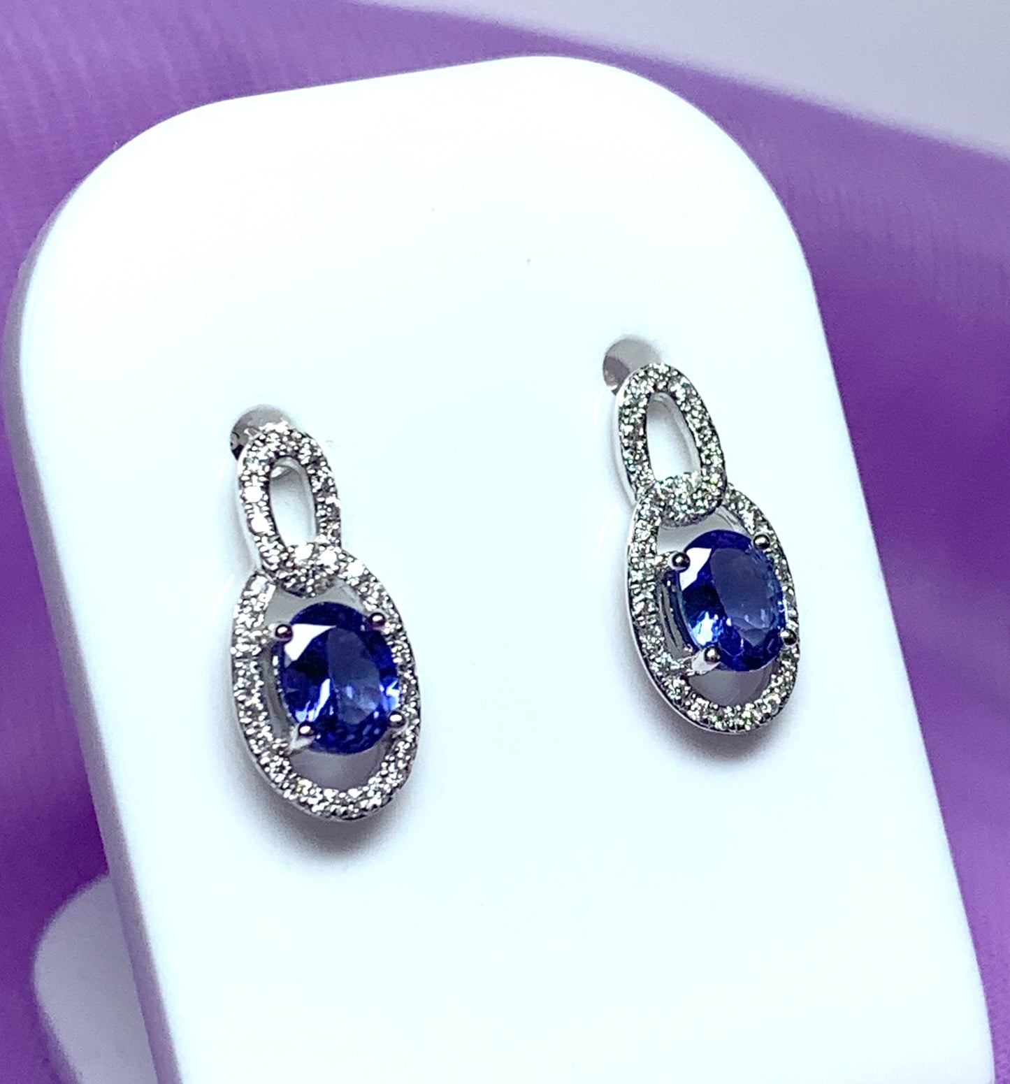 Oval cluster tanzanite and diamond earrings