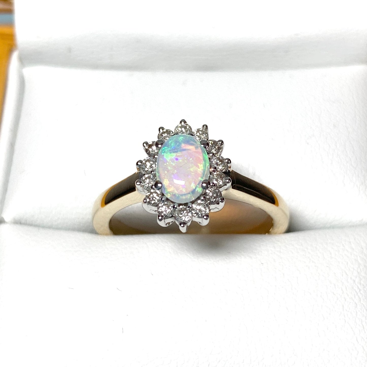 Real oval opal and diamond cluster yellow gold ring