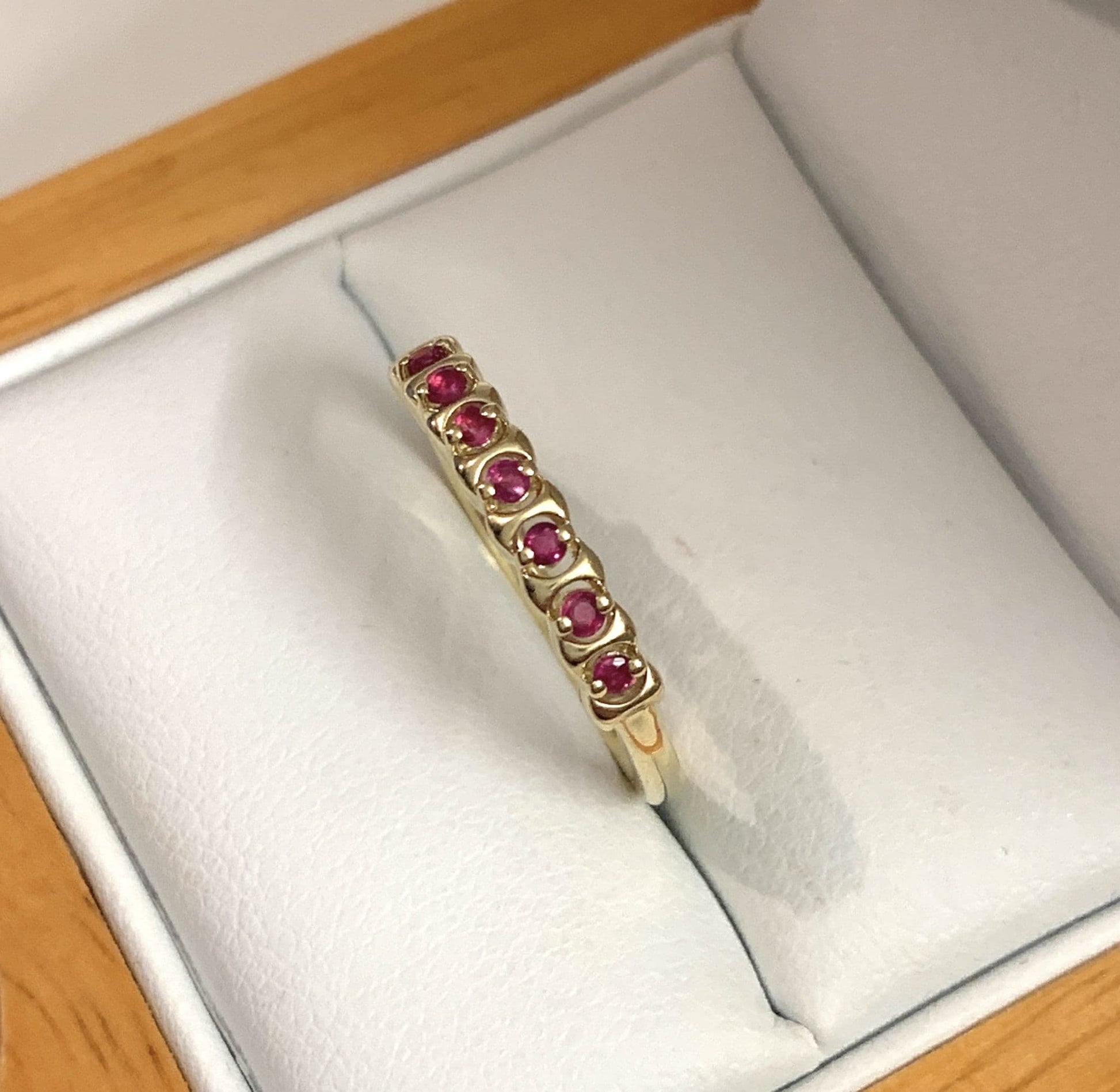 Red ruby eternity ring yellow gold