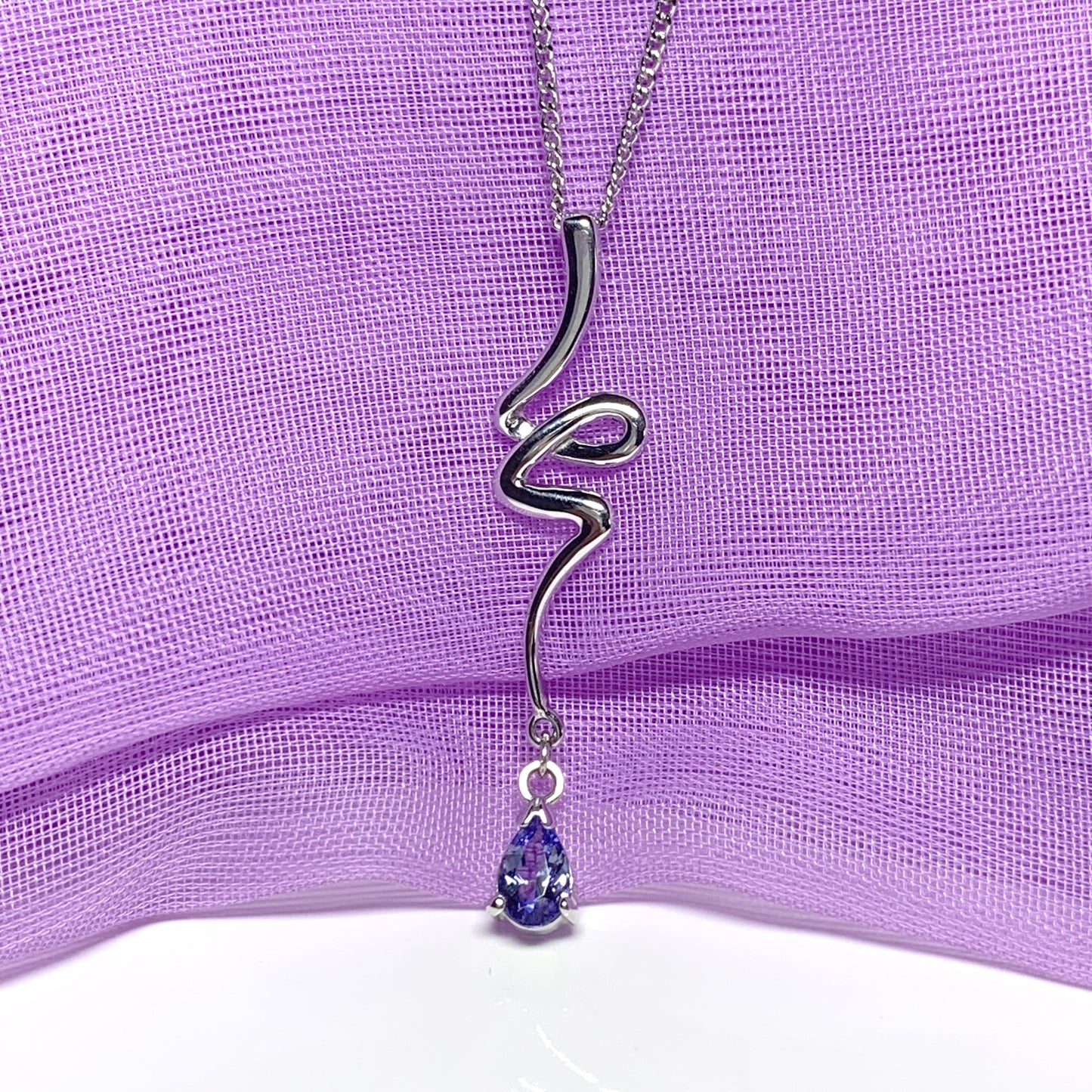 Real tanzanite white gold fancy swirl necklace pear shaped