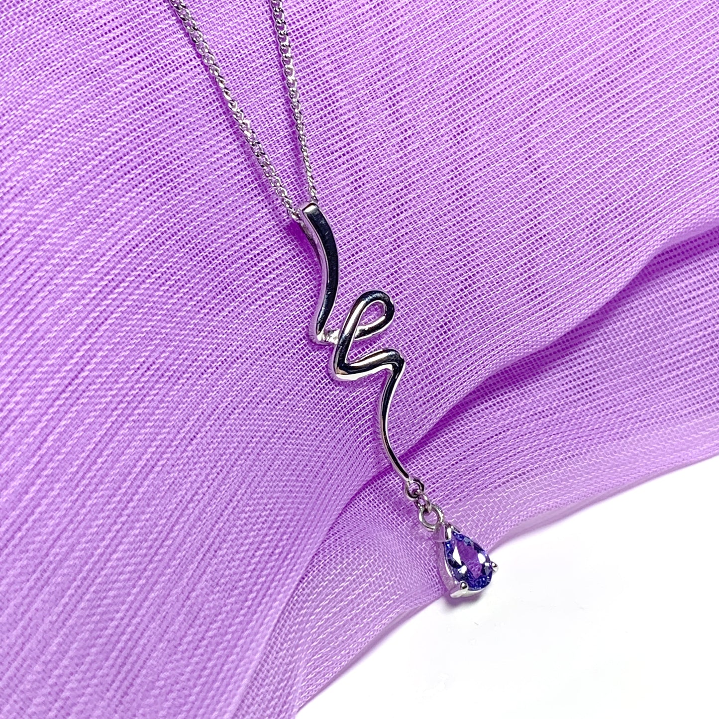 Real tanzanite white gold fancy swirl necklace pear shaped