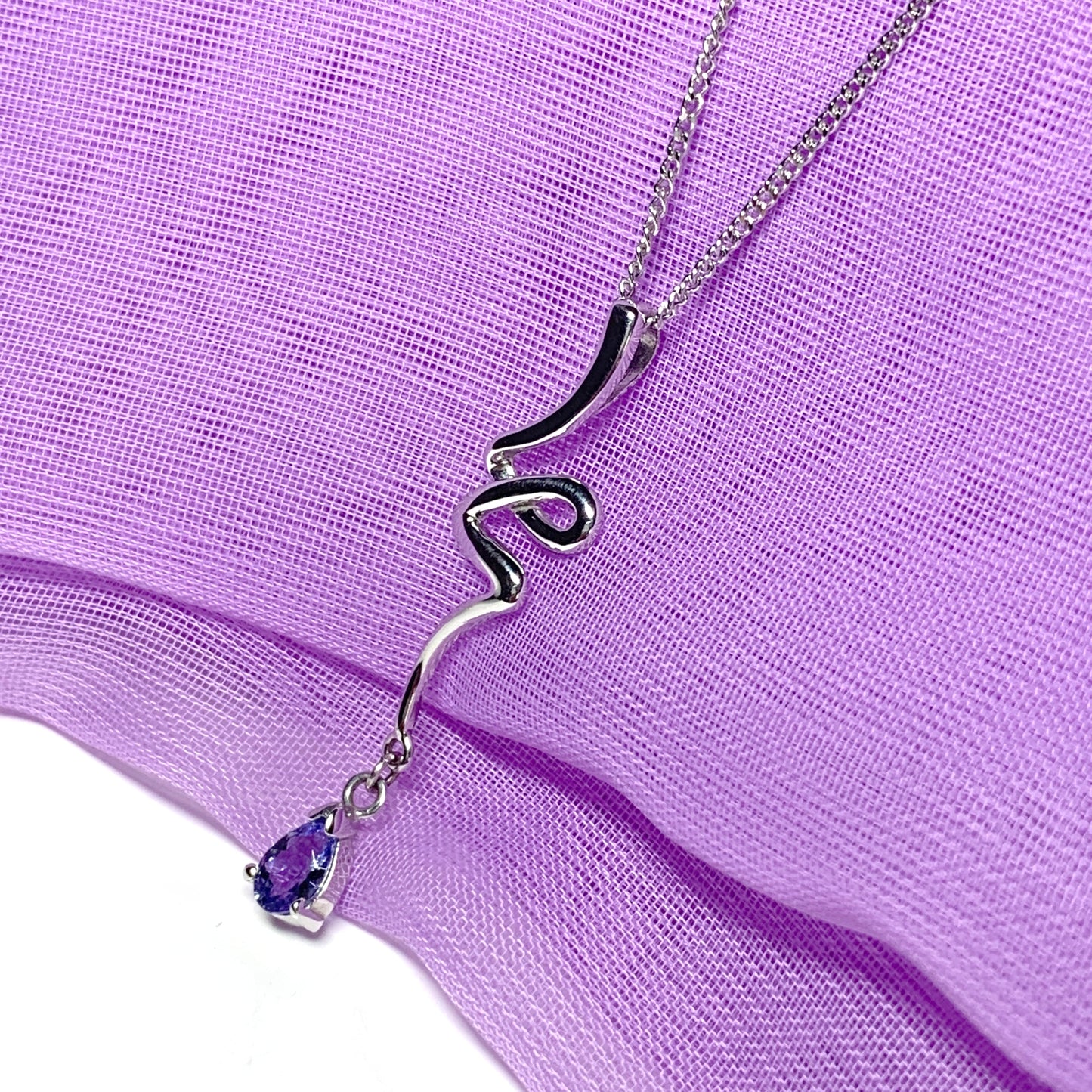 Real tanzanite white gold fancy swirl necklace pear shaped