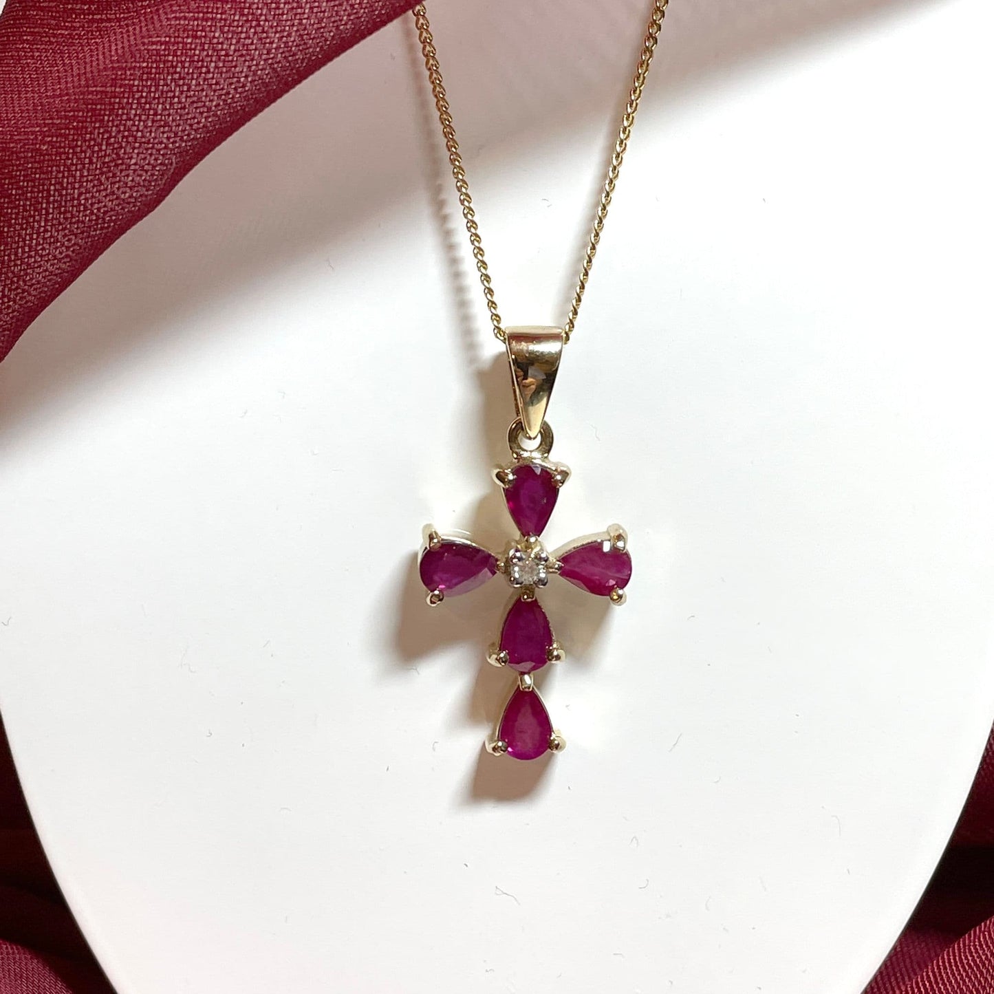 Red ruby and diamond yellow gold cross necklace