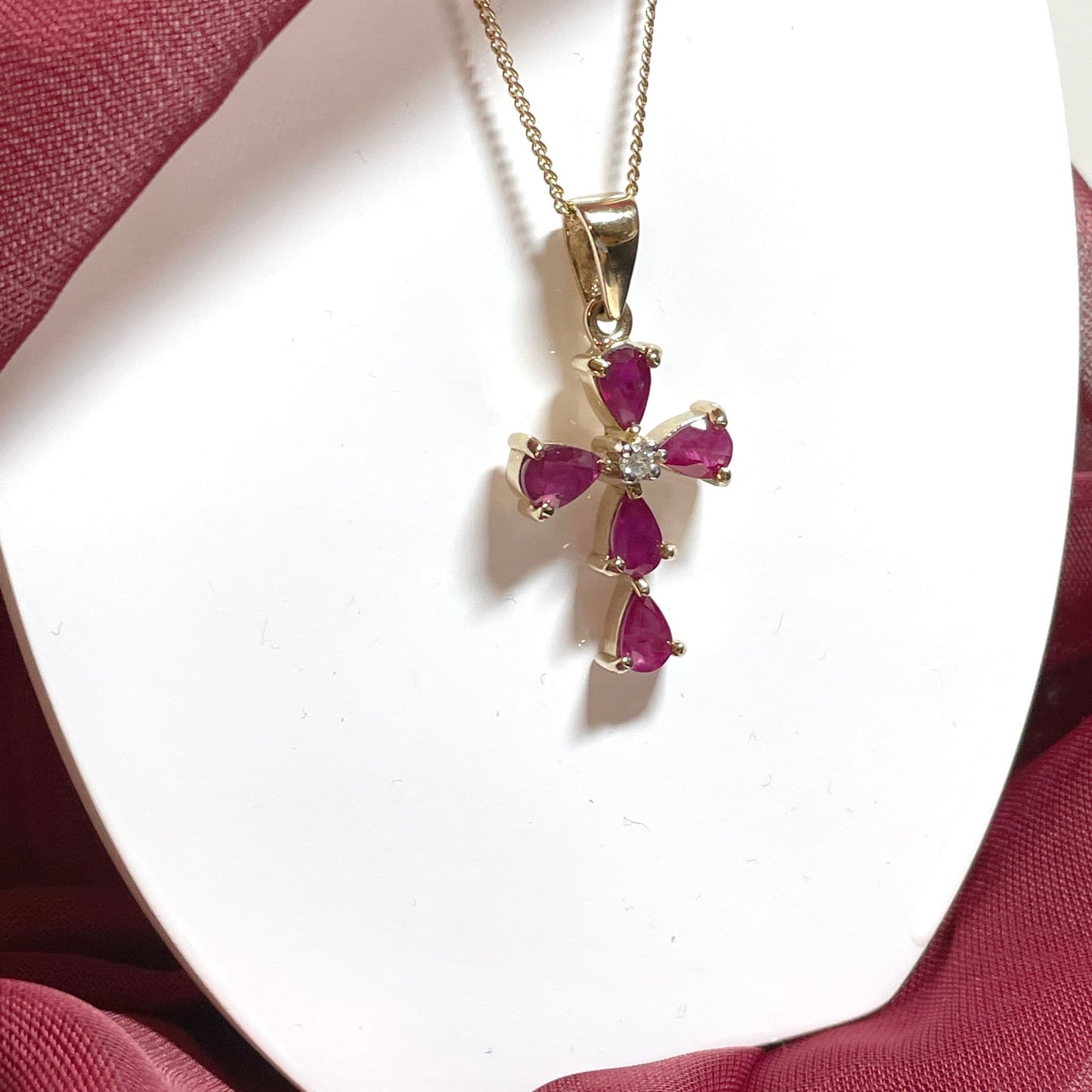 Red ruby and diamond yellow gold cross necklace