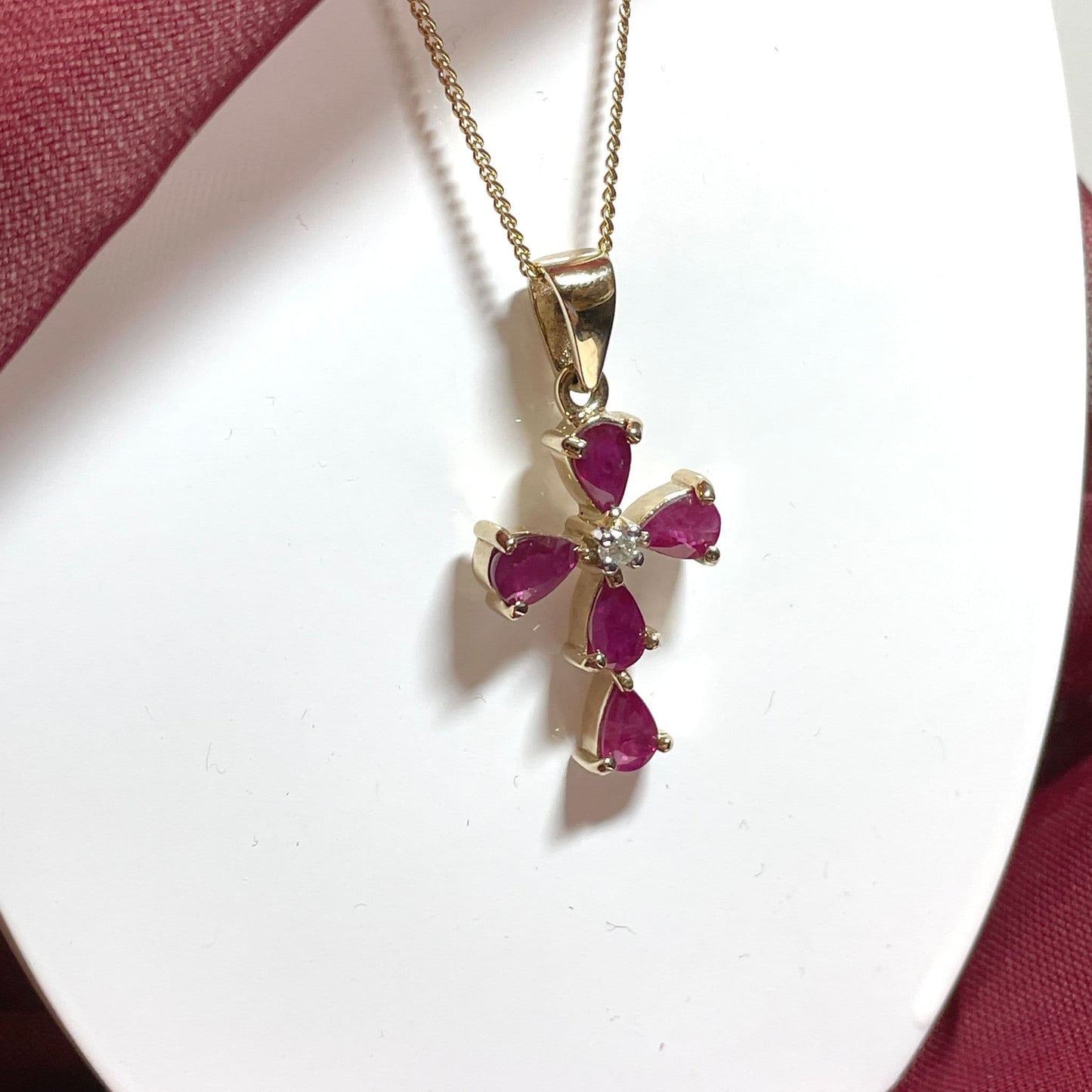 Red ruby and diamond yellow gold cross necklace