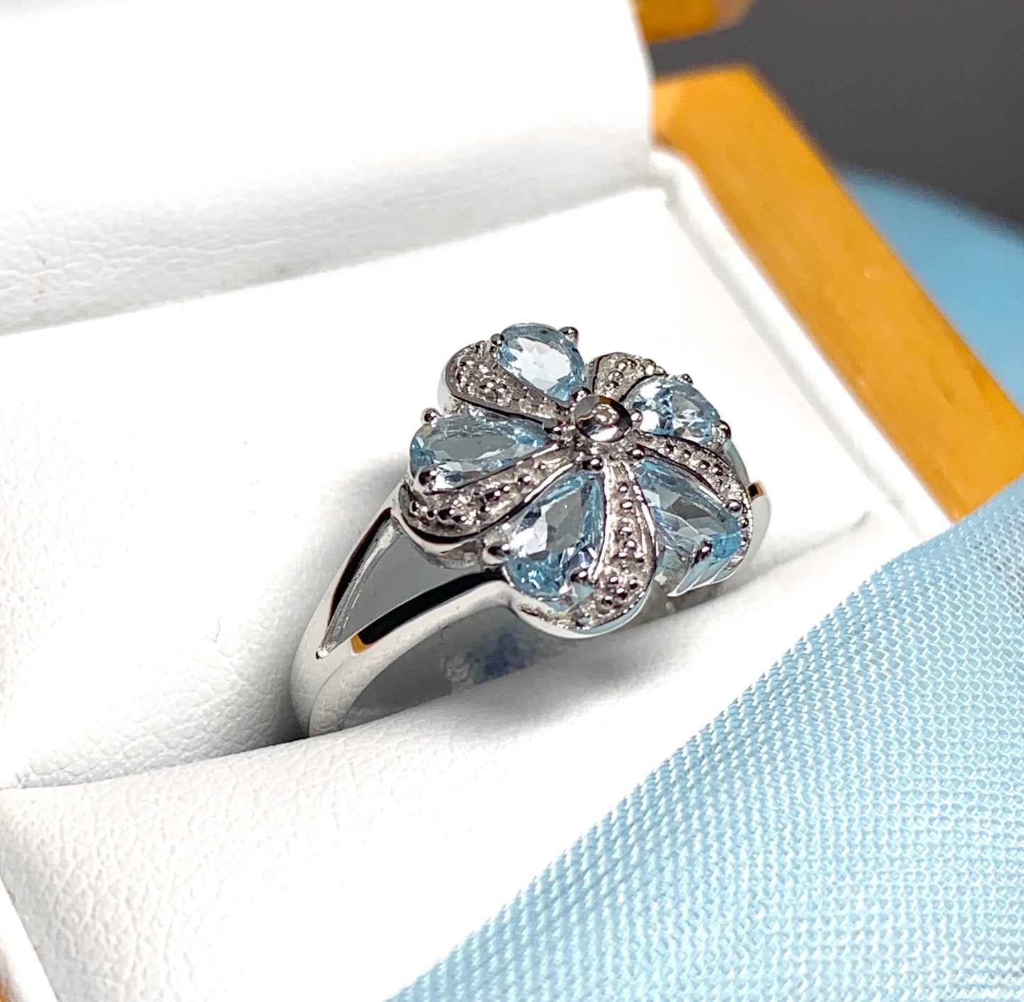 Round Blue Topaz And Diamond Sterling Silver Daisy Petal Cluster Ring