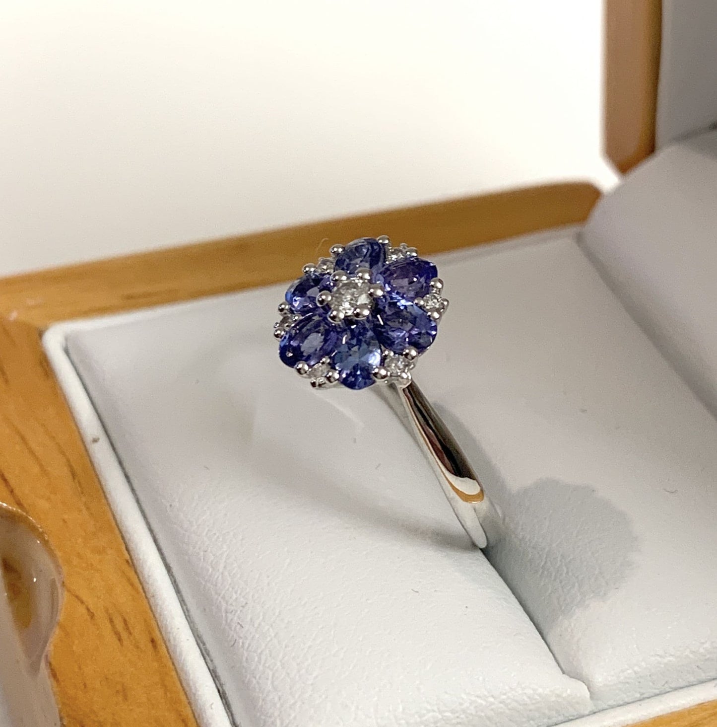 Round real tanzanite and diamond fancy white gold cluster ring