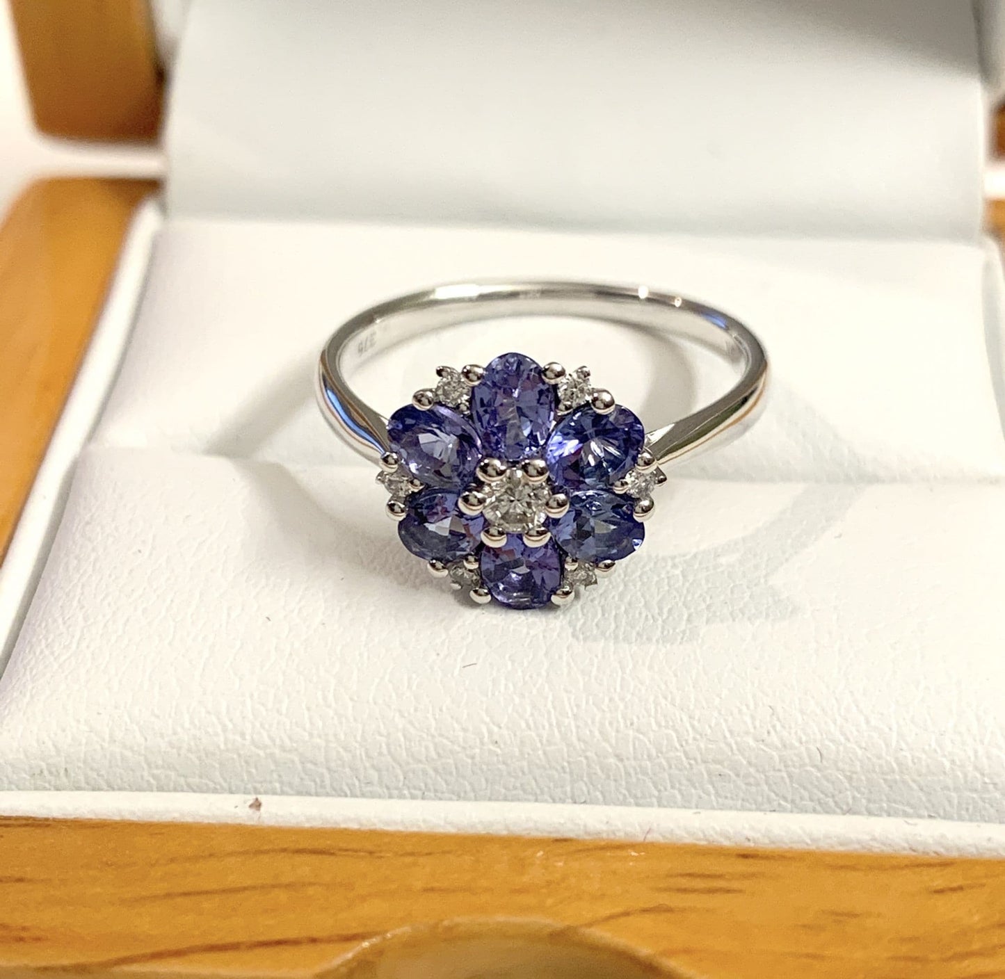 Round real tanzanite and diamond fancy white gold cluster ring
