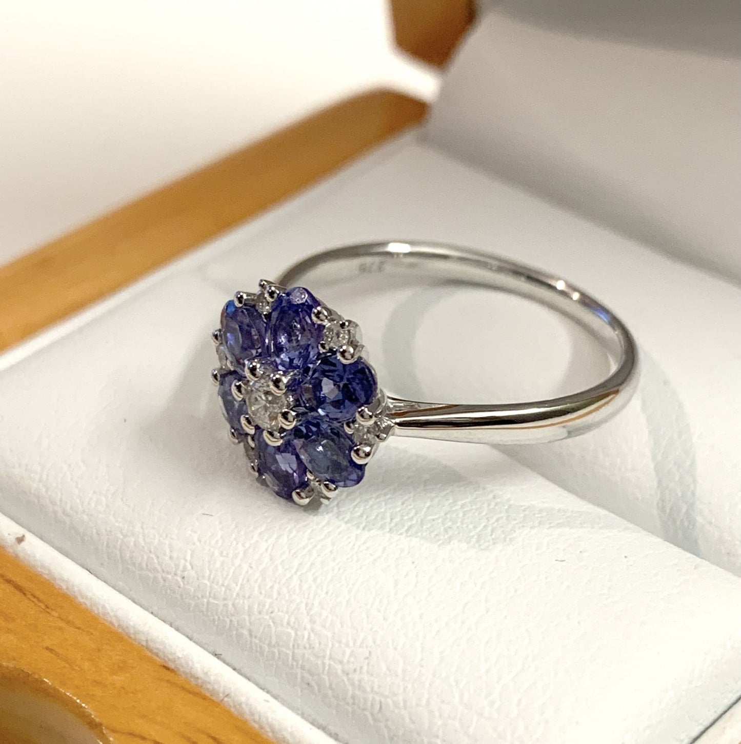 Round real tanzanite and diamond fancy white gold cluster ring