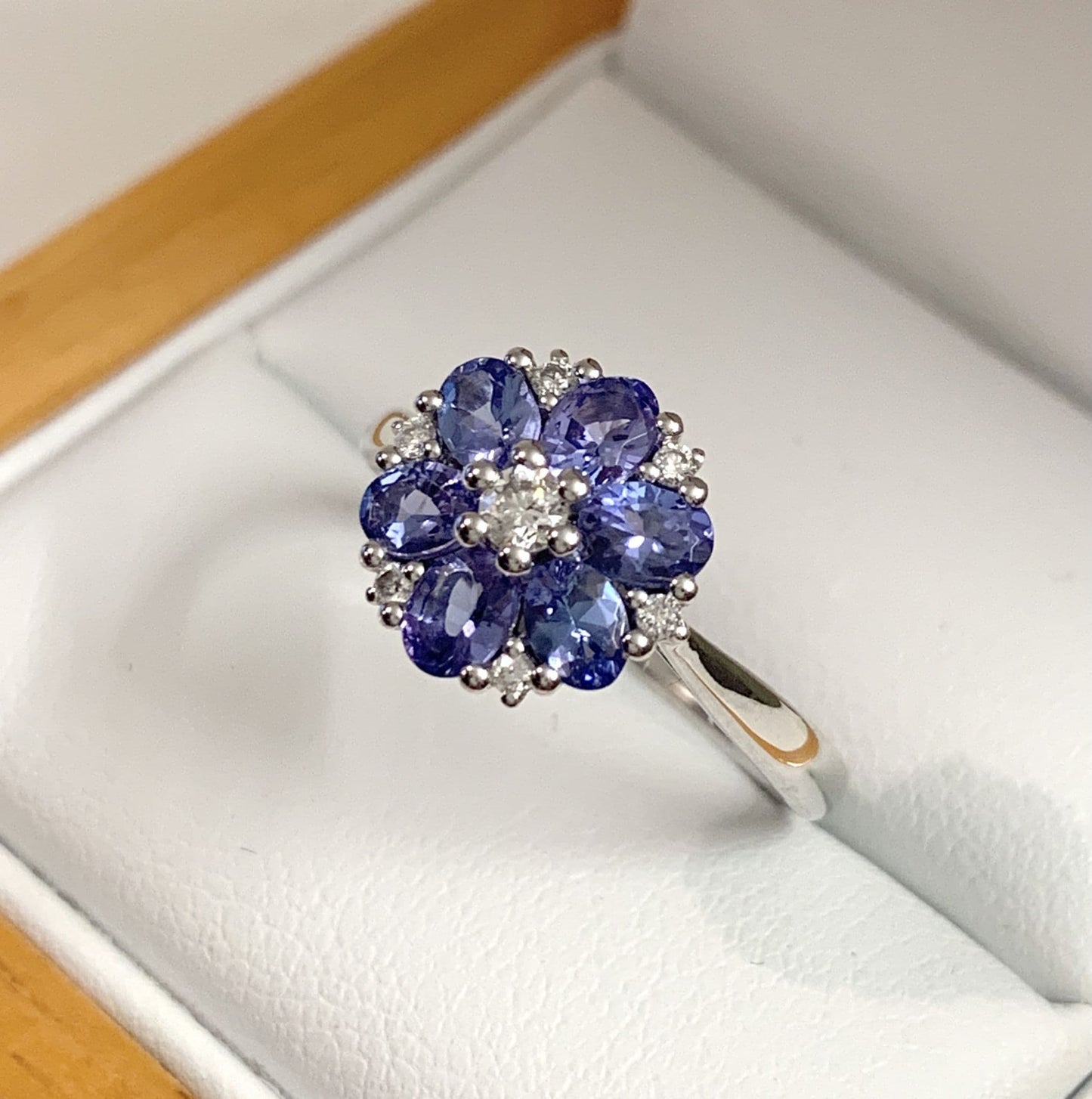 Round real tanzanite and diamond fancy white gold cluster ring