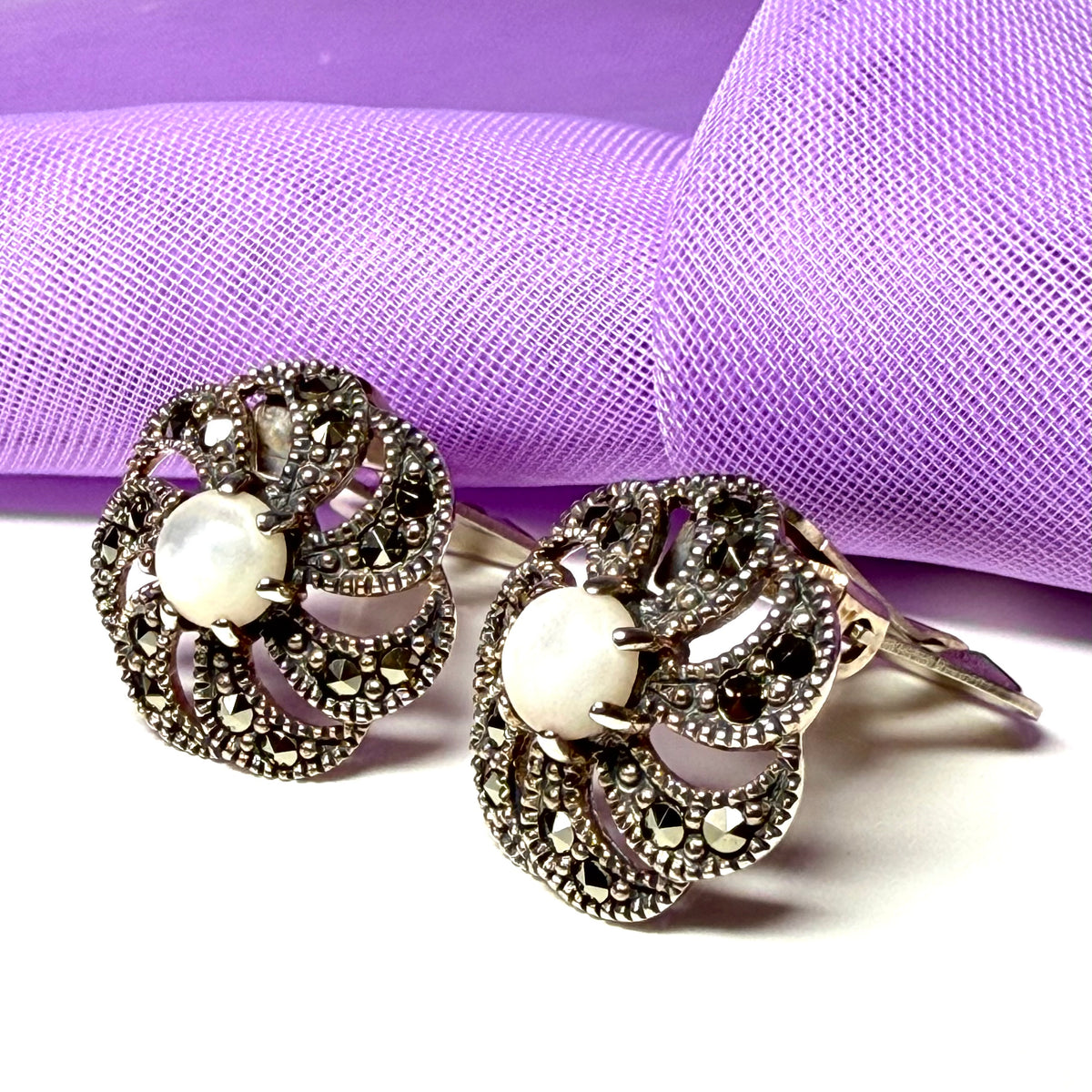 Round clip on earrings with marcasite and mother of pearl and sterling silver