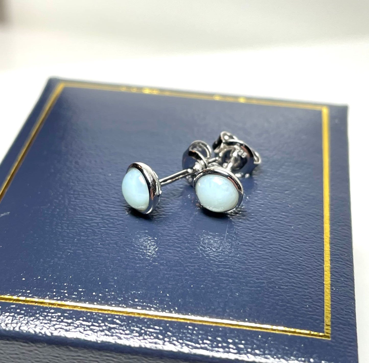 Larimar round sterling silver rubbed over stud earrings