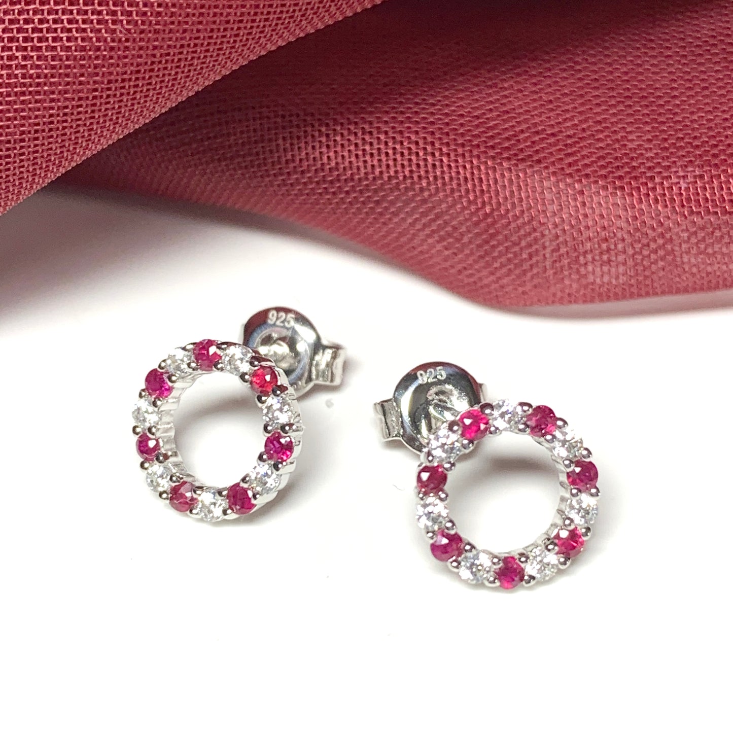 Round red ruby and cubic zirconia sterling silver stud earrings