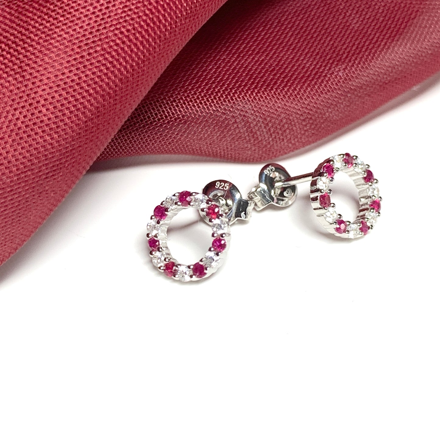 Round red ruby and cubic zirconia sterling silver stud earrings