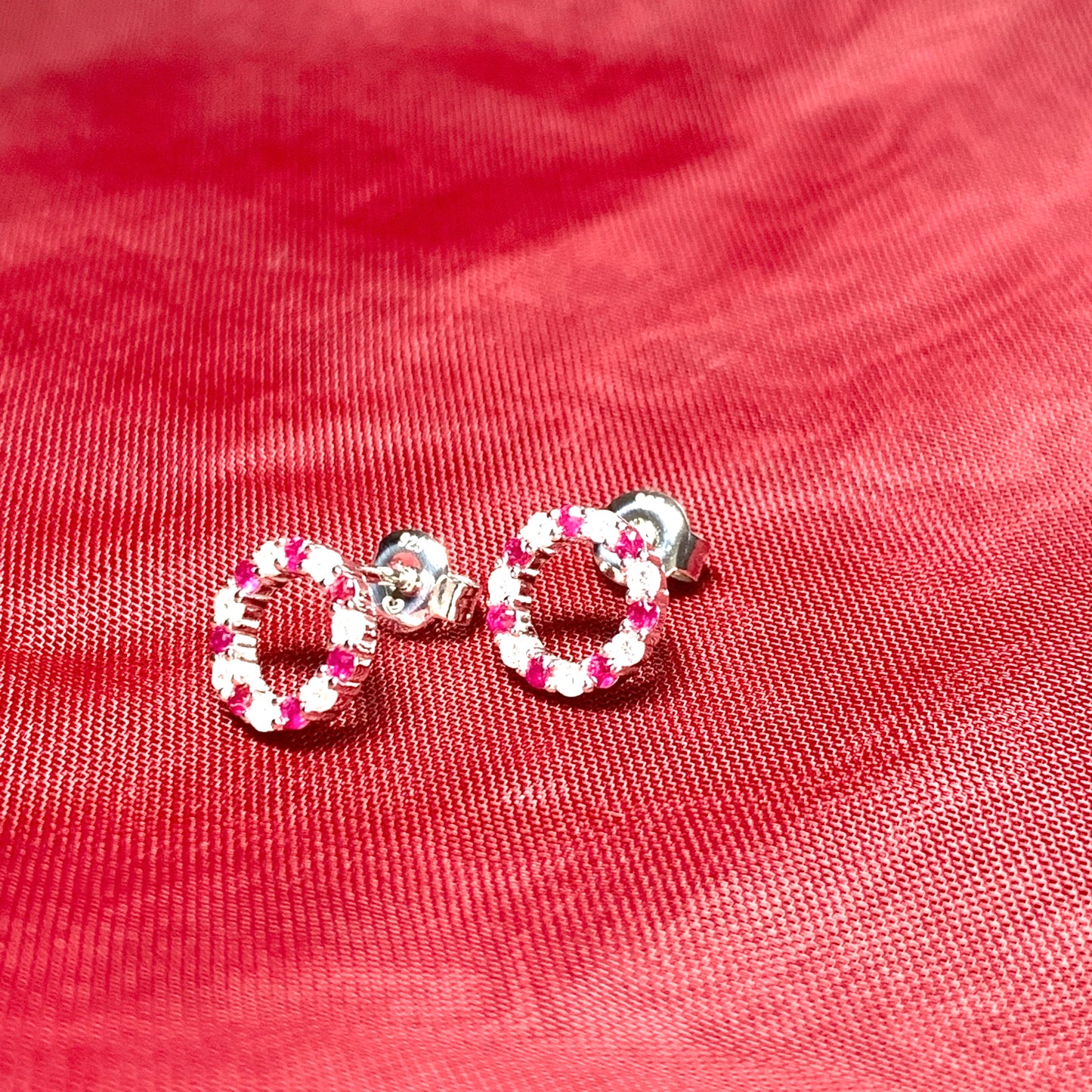 Round red ruby and cubic zirconia sterling silver stud earrings