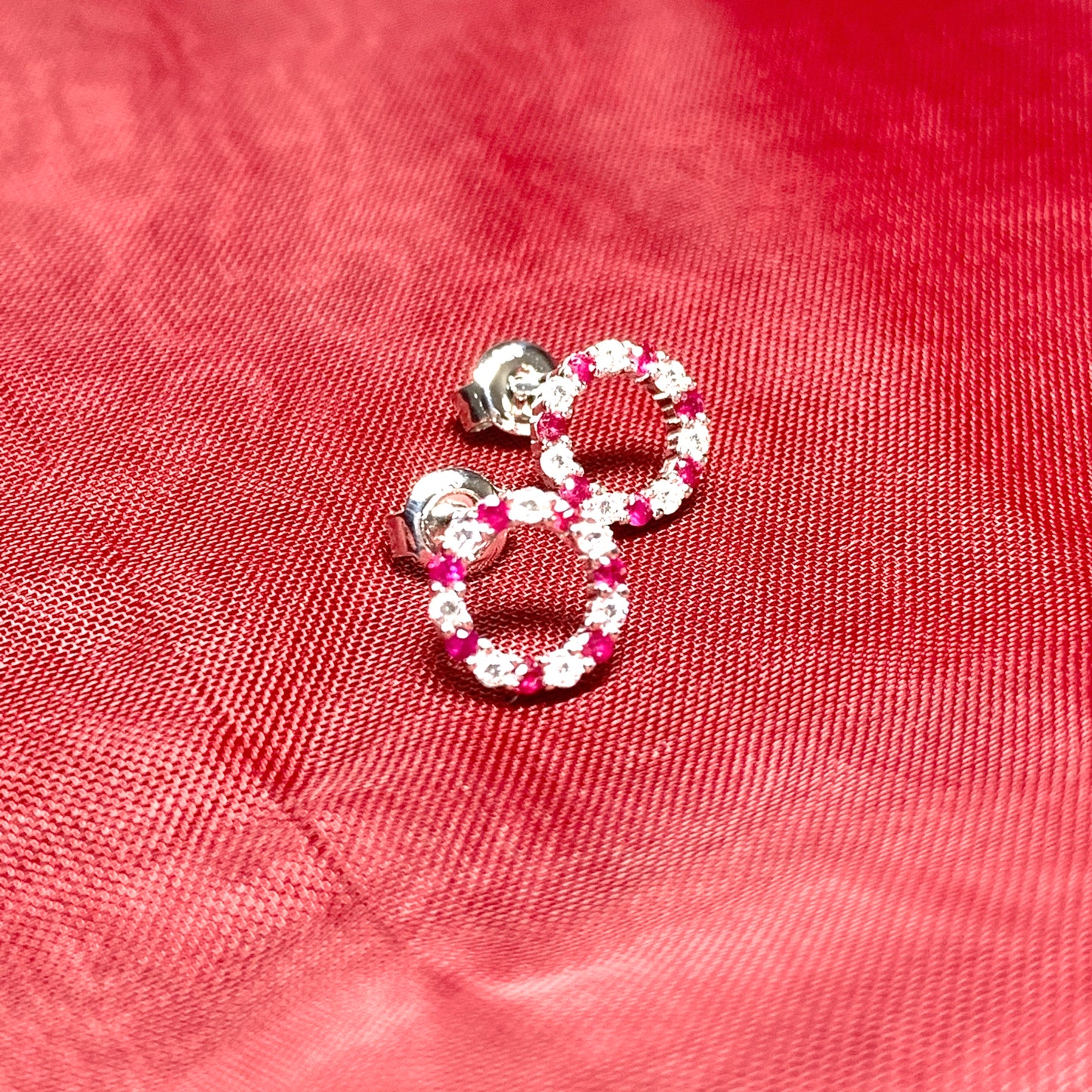 Round red ruby and cubic zirconia sterling silver stud earrings