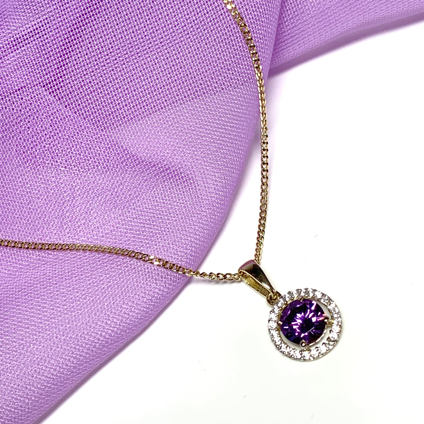 Round yellow gold and amethyst and cubic zirconia necklace pendent