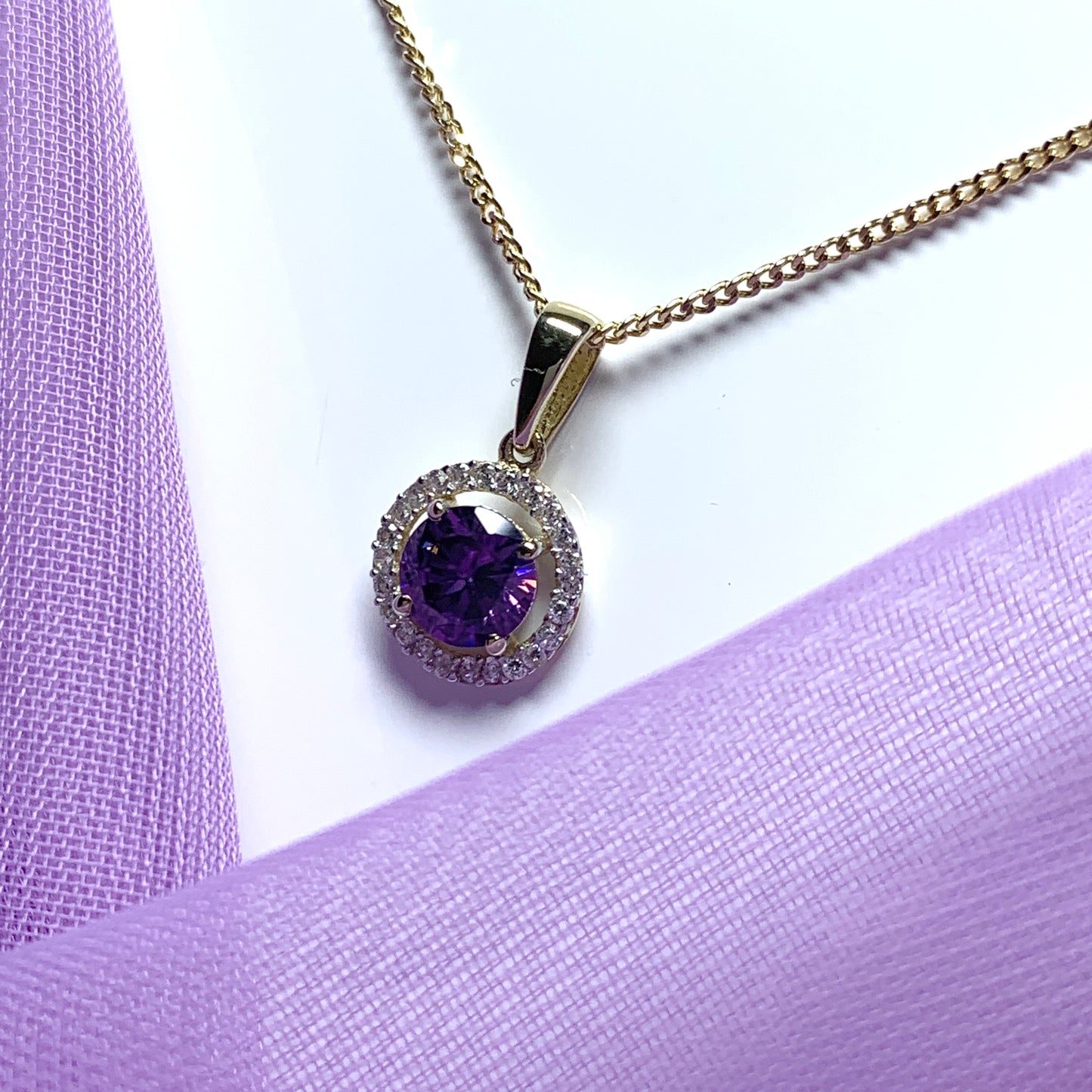 Round yellow gold and amethyst and cubic zirconia necklace pendent