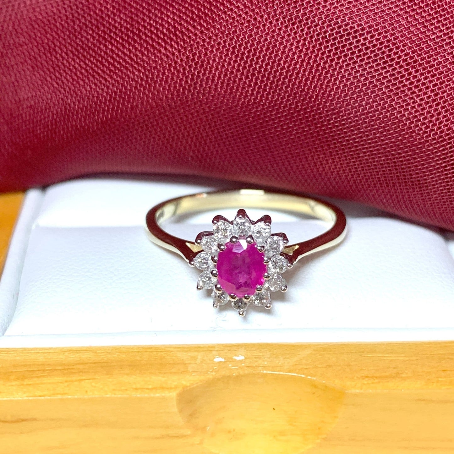Oval Ruby And Diamond Cluster Ring in Yellow Gold