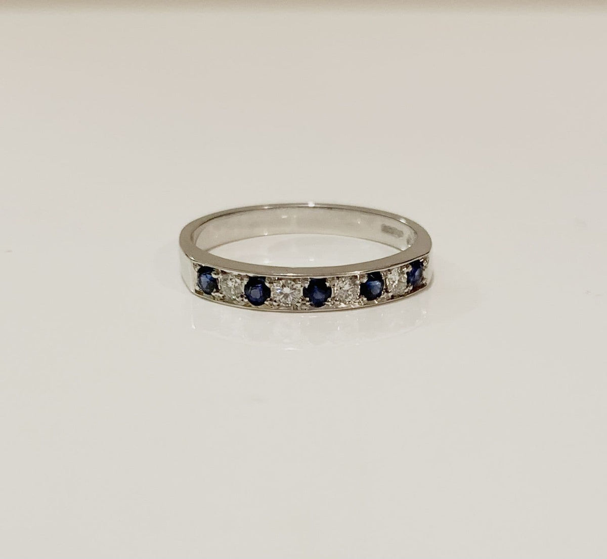 Blue Sapphire And Diamond White Gold Eternity Ring
