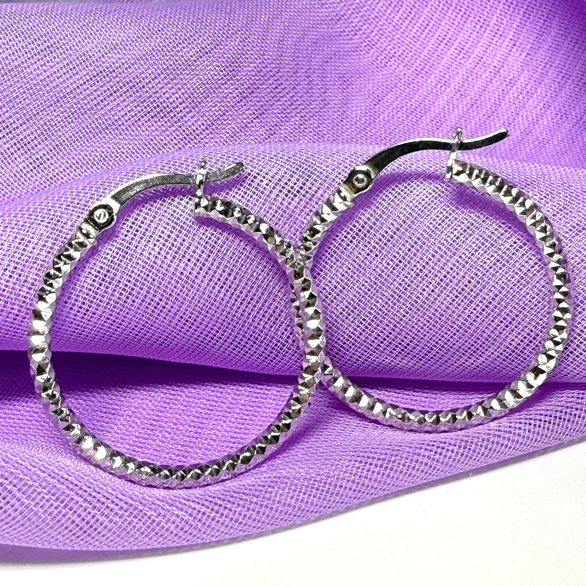Silver hoop earrings diamond cut patterned