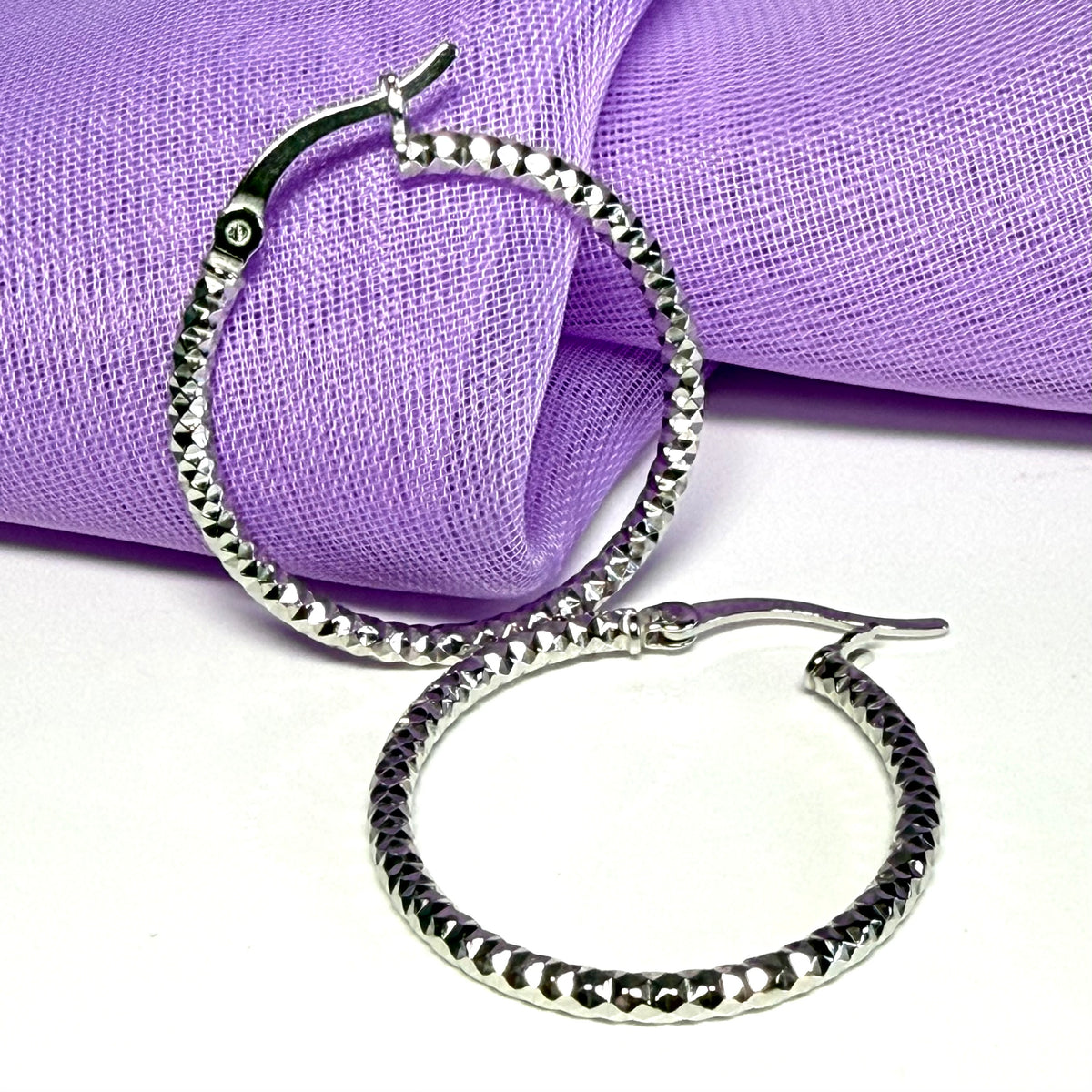 Silver hoop earrings diamond cut patterned