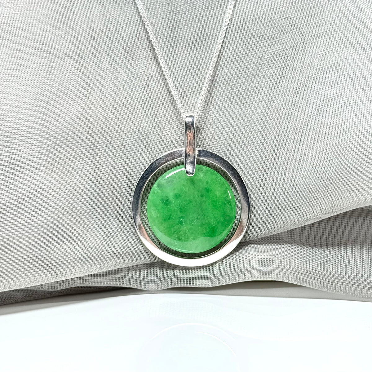 Large silver round shaped green real jade necklace pendant with a chain