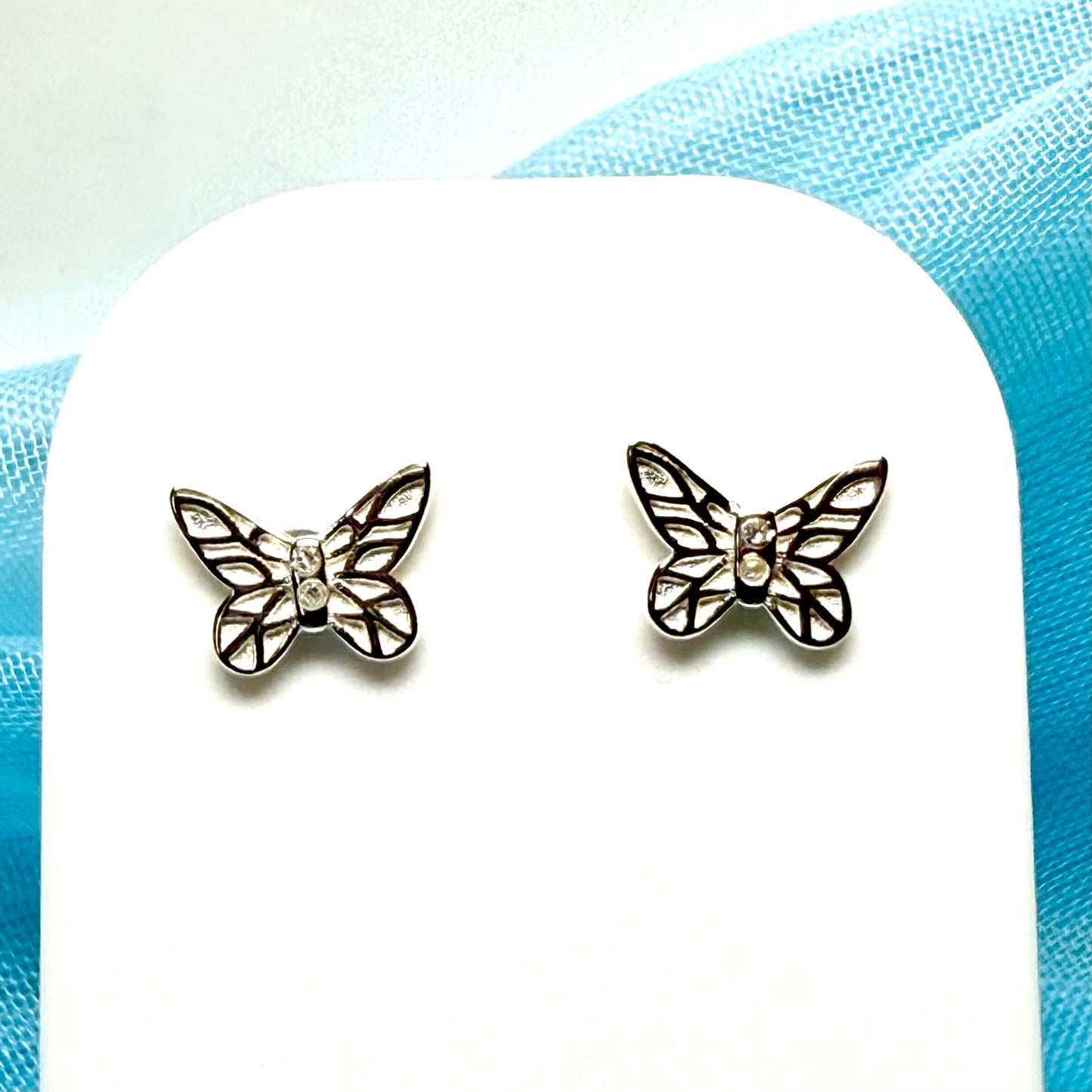Small diamond set sterling silver butterfly shaped stud earrings