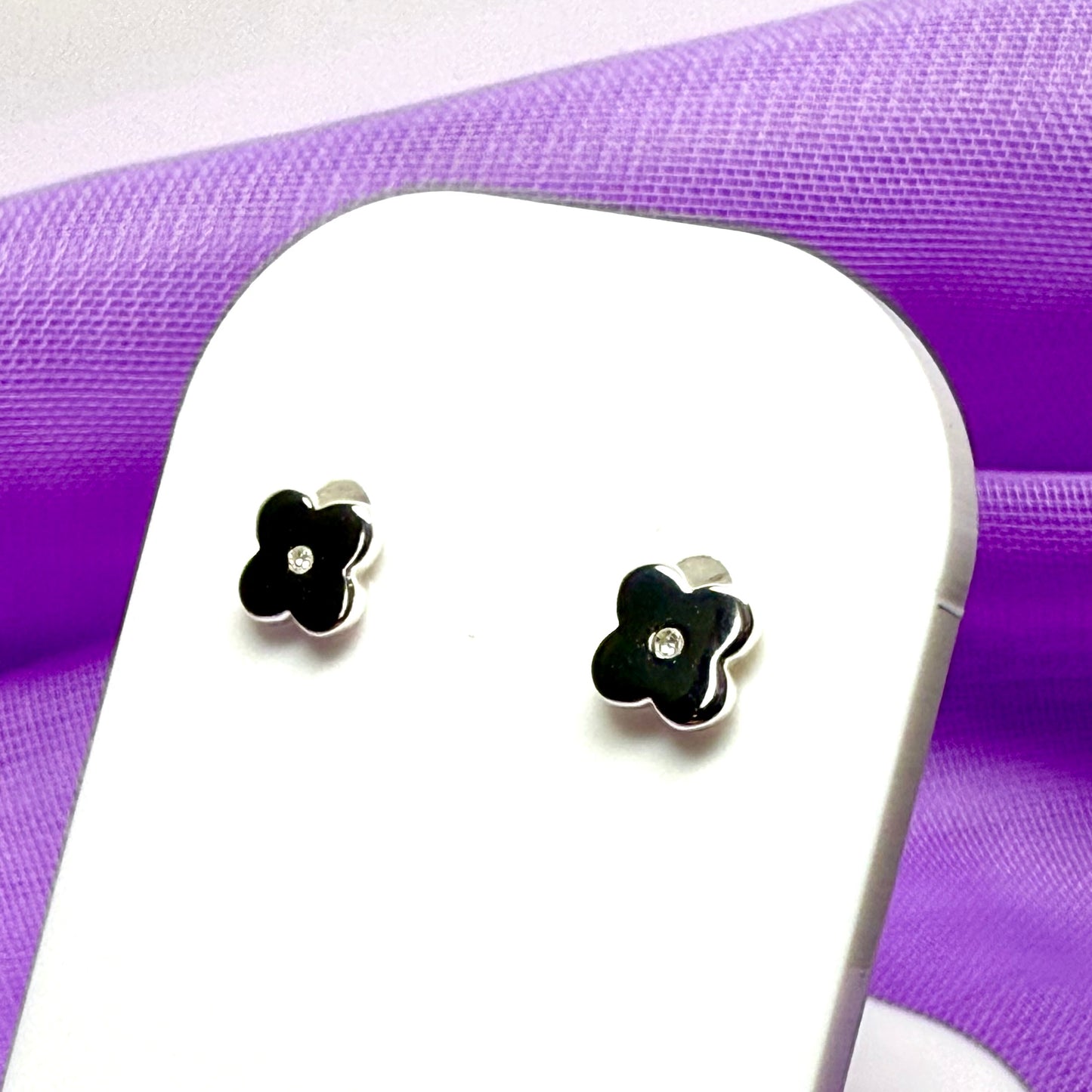 Small diamond set sterling silver daisy shaped stud earrings