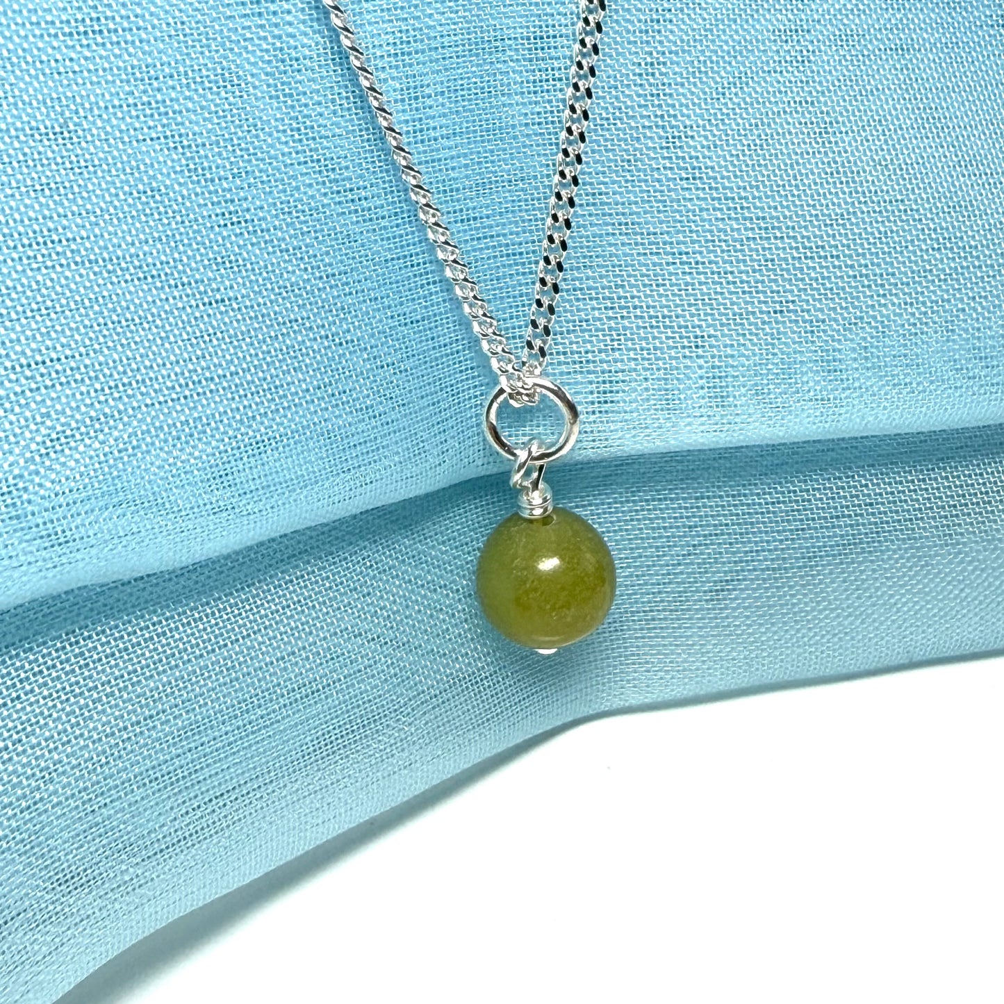 A gorgeous small real green gypsum necklace ball shaped, a really gorgeous round pendant with chain too