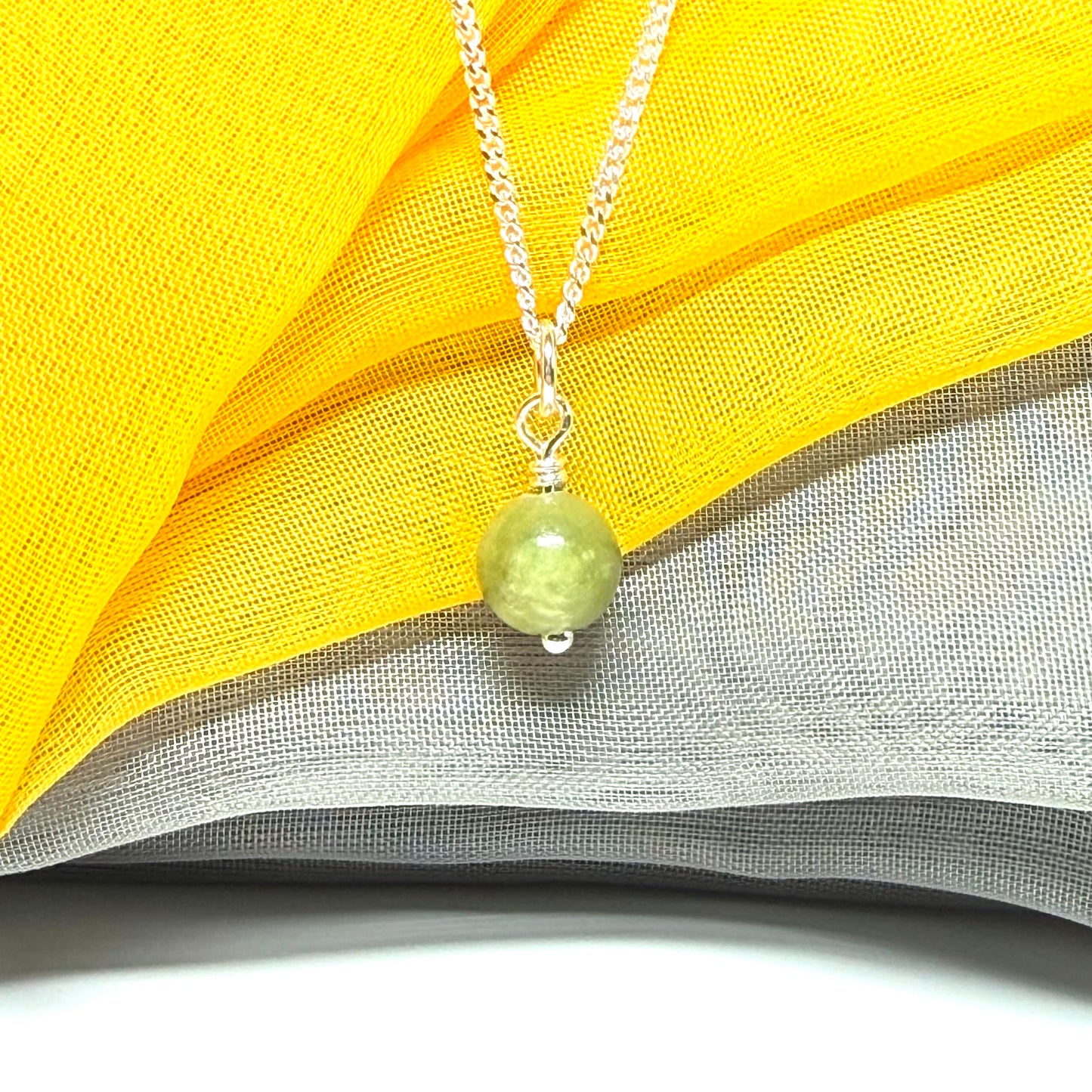 Small round 8.5 mm green real gypsum necklace ball shaped pendant with a chain